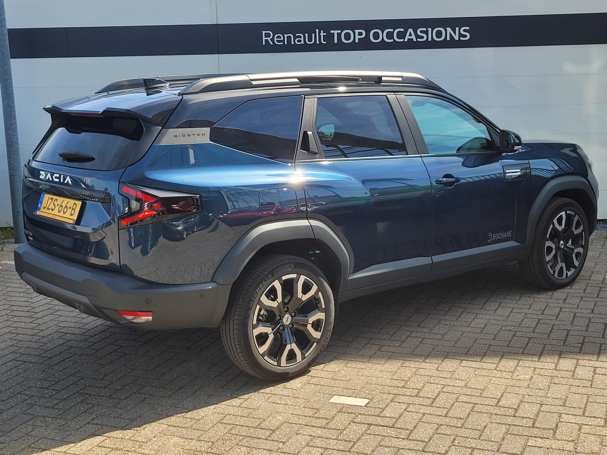 Dacia Bigster 1.8 Hybrid 155 Limited Edition | Schuif/Kantel, Auto's, Stof, Met garantie (alle), Blauw, Origineel Nederlands