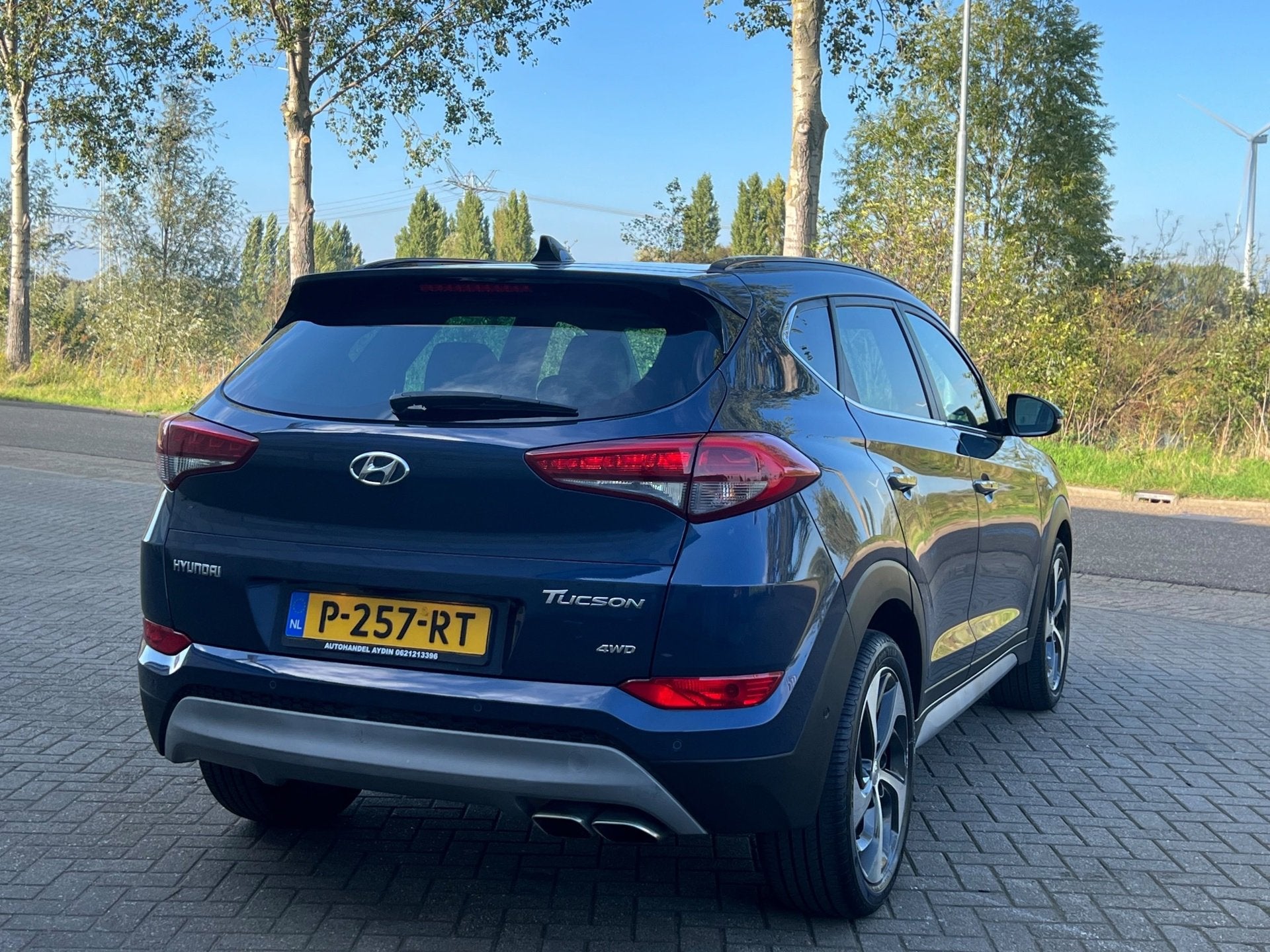 Hyundai Tucson 1.6 T-GDi Premium 4WD panorama dak automaat, Auto's, Dealer onderhouden, Gebruikt, 4 cilinders, Blauw