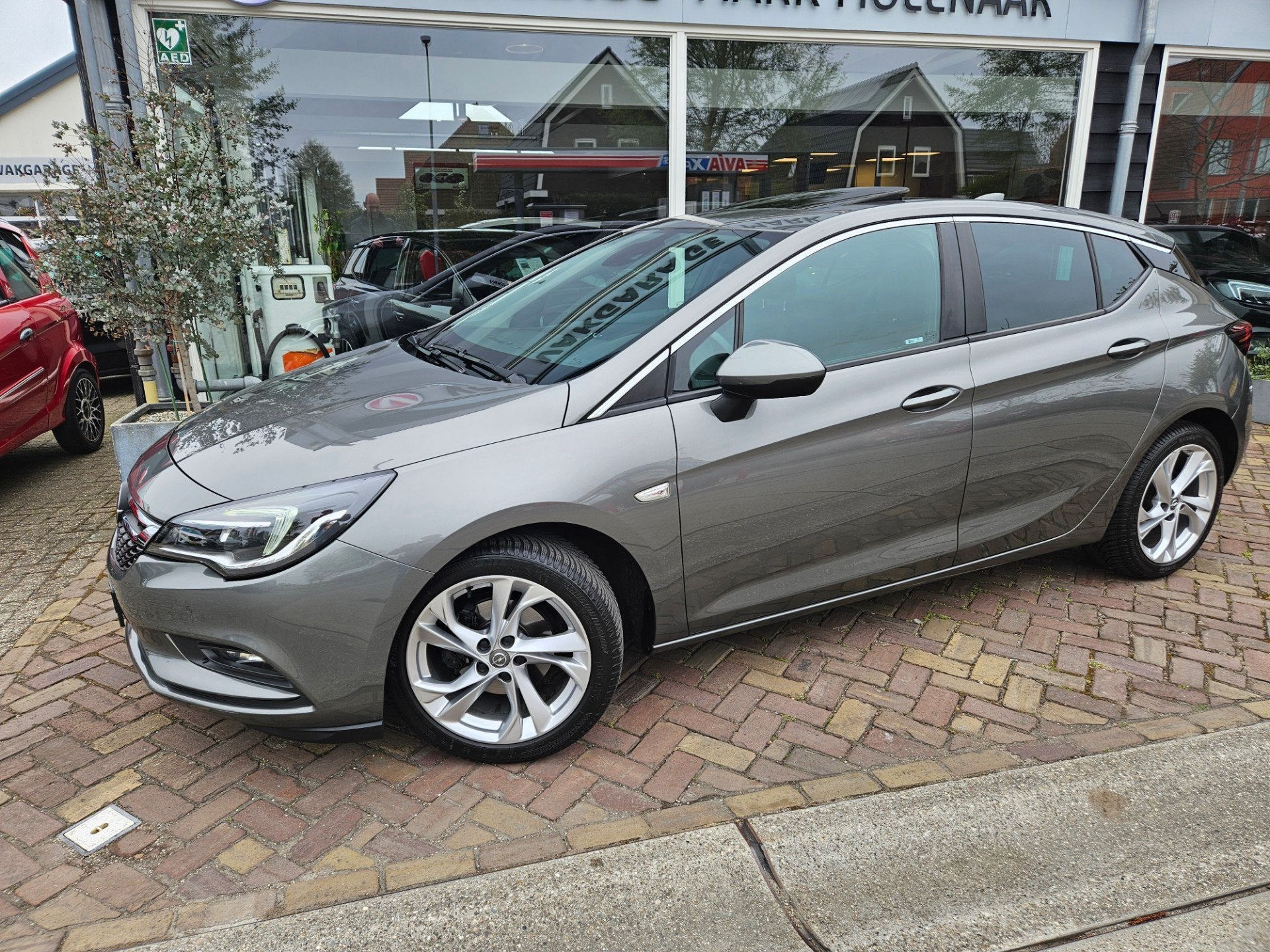 Opel Astra 1.0 Online Edition,opendak,carplay, Auto's, Gebruikt, Euro 6, 610 kg, 23 km/l