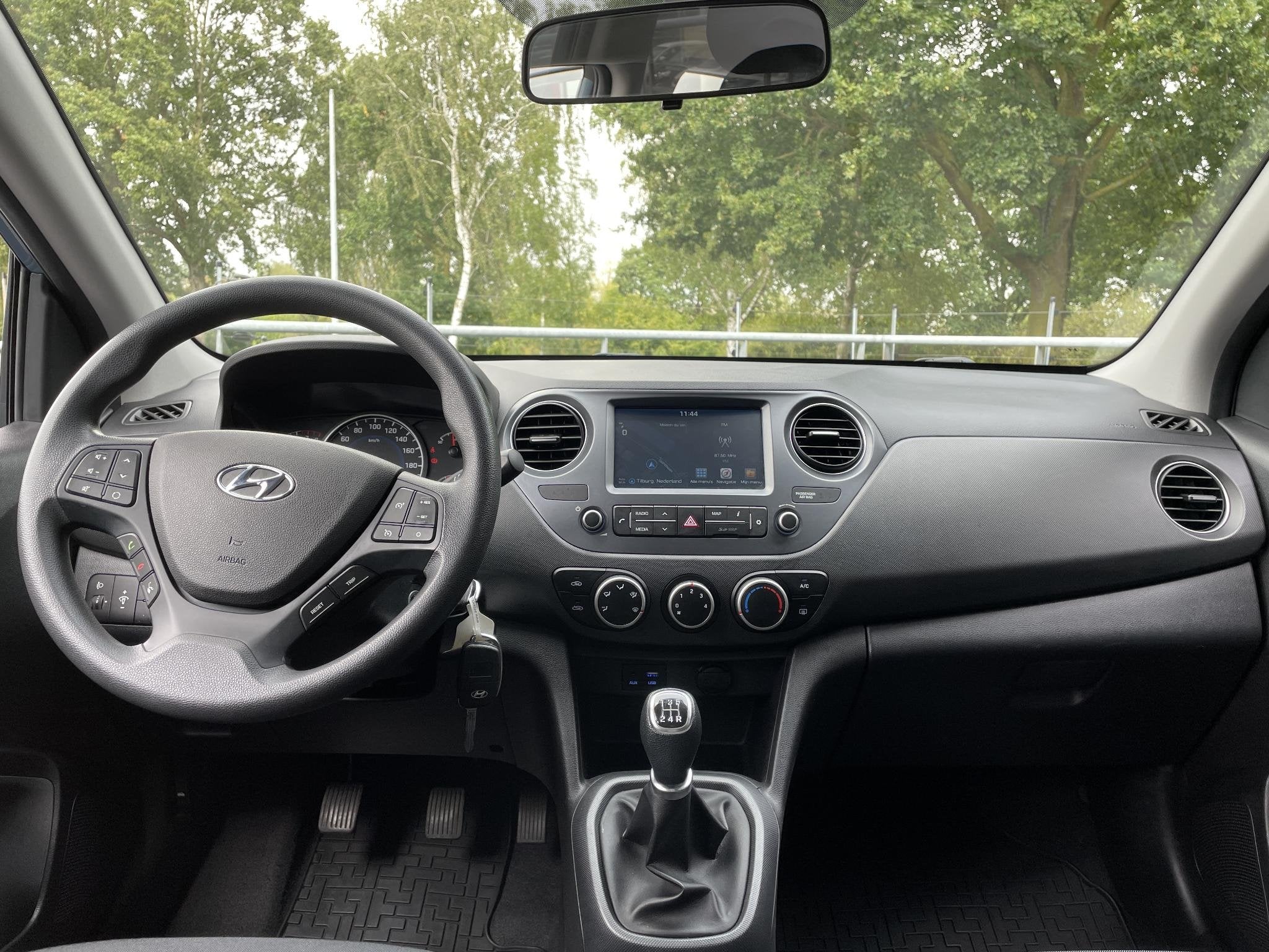 Hyundai i10 1.0i Comfort 67PK | Navigatie | Carplay | Cruise, Auto's, Voorwielaandrijving, Euro 5, Stof, Gebruikt