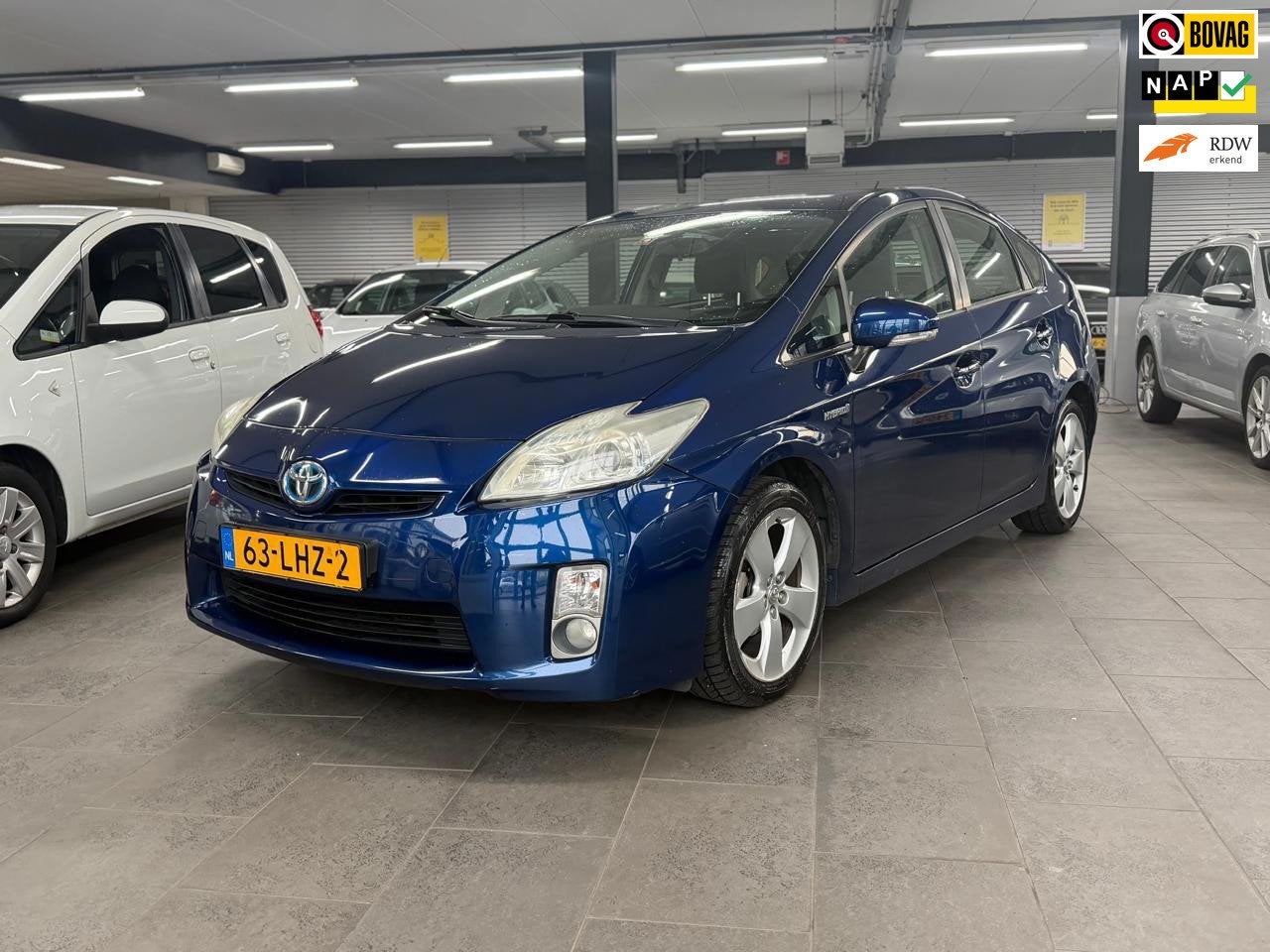 Toyota Prius 1.8 Aspiration 1-eigenaar clima cruise control, Auto's, Stof, Gebruikt, 4 cilinders, Blauw