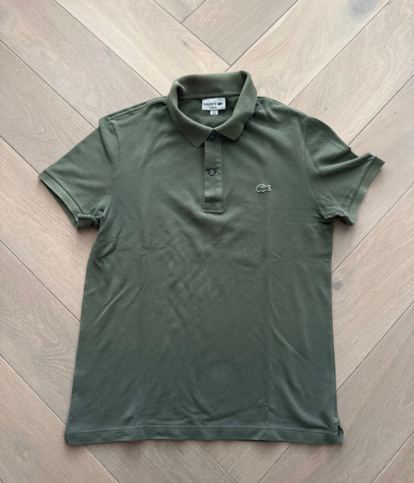 Donkergroene Lacoste polo, Ophalen of Verzenden, Zo goed als nieuw, Maat 48/50 (M), Groen