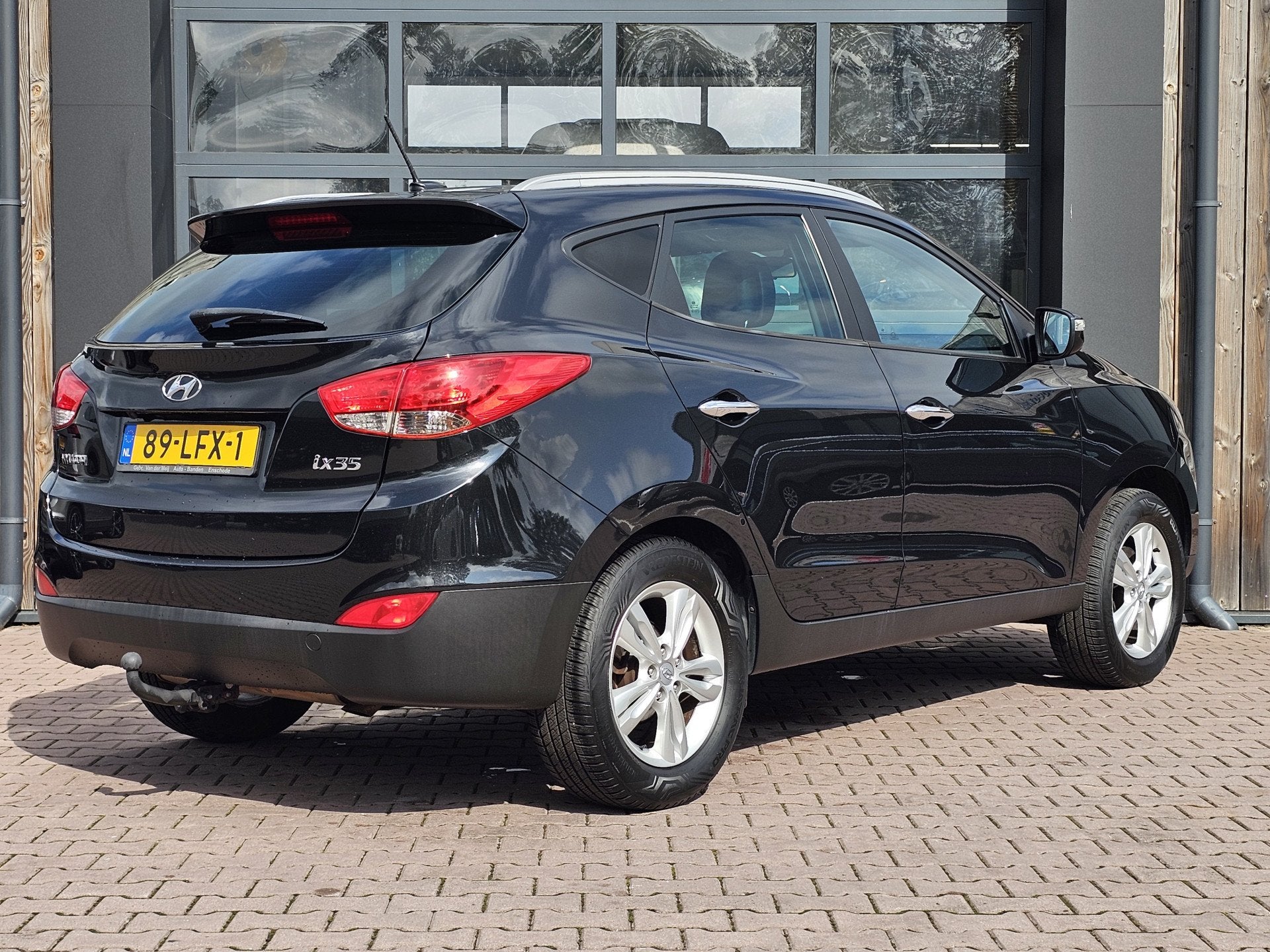Hyundai ix35 2.0i Style | Automaat | Navi | Trekhaak | Cruis, Gebruikt, Zwart, 4 cilinders, Met garantie (alle)