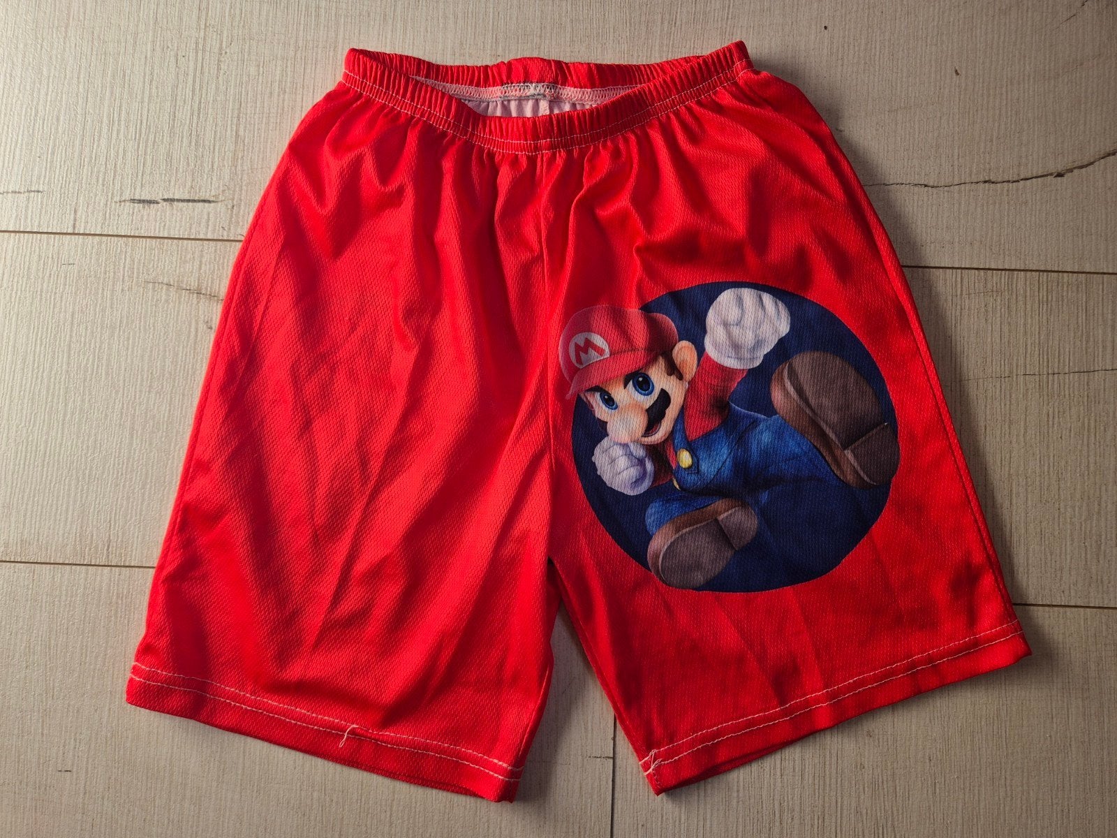 Rode Super Mario short mt 140, als NIEUW, Ophalen, Jongen, Broek