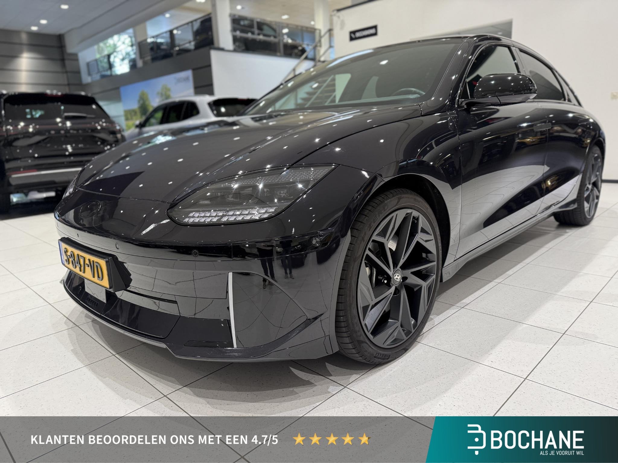 Hyundai IONIQ 6 First Edition AWD 77.4 kWh | Schuifdak | Tre, Auto's, Gebruikt, Blauw, Leder en Stof, Origineel Nederlands
