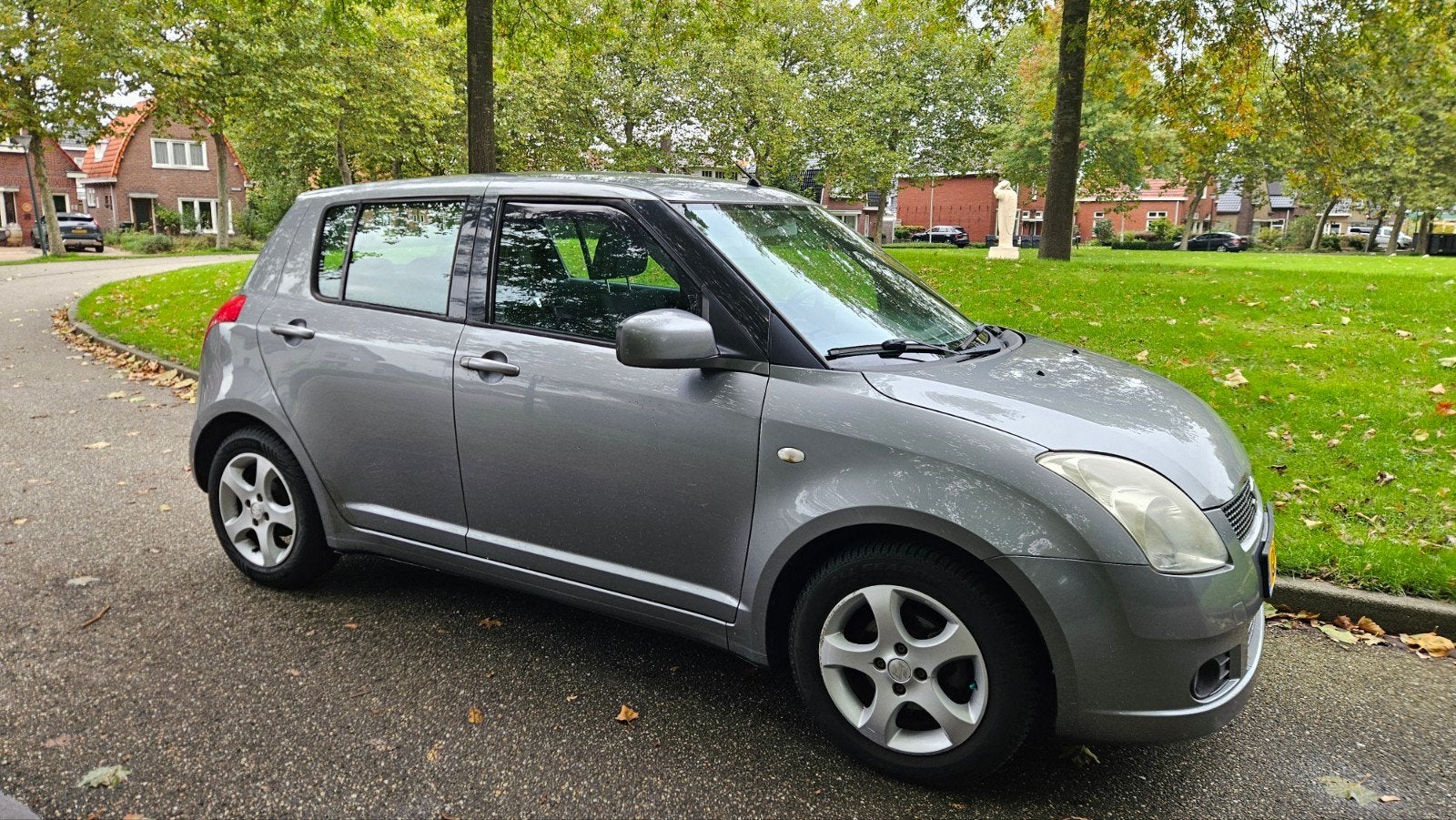 Suzuki Swift 2006 Grijs 5 deurs, Auto's, Voorwielaandrijving, Stof, 40 €/maand, Zwart