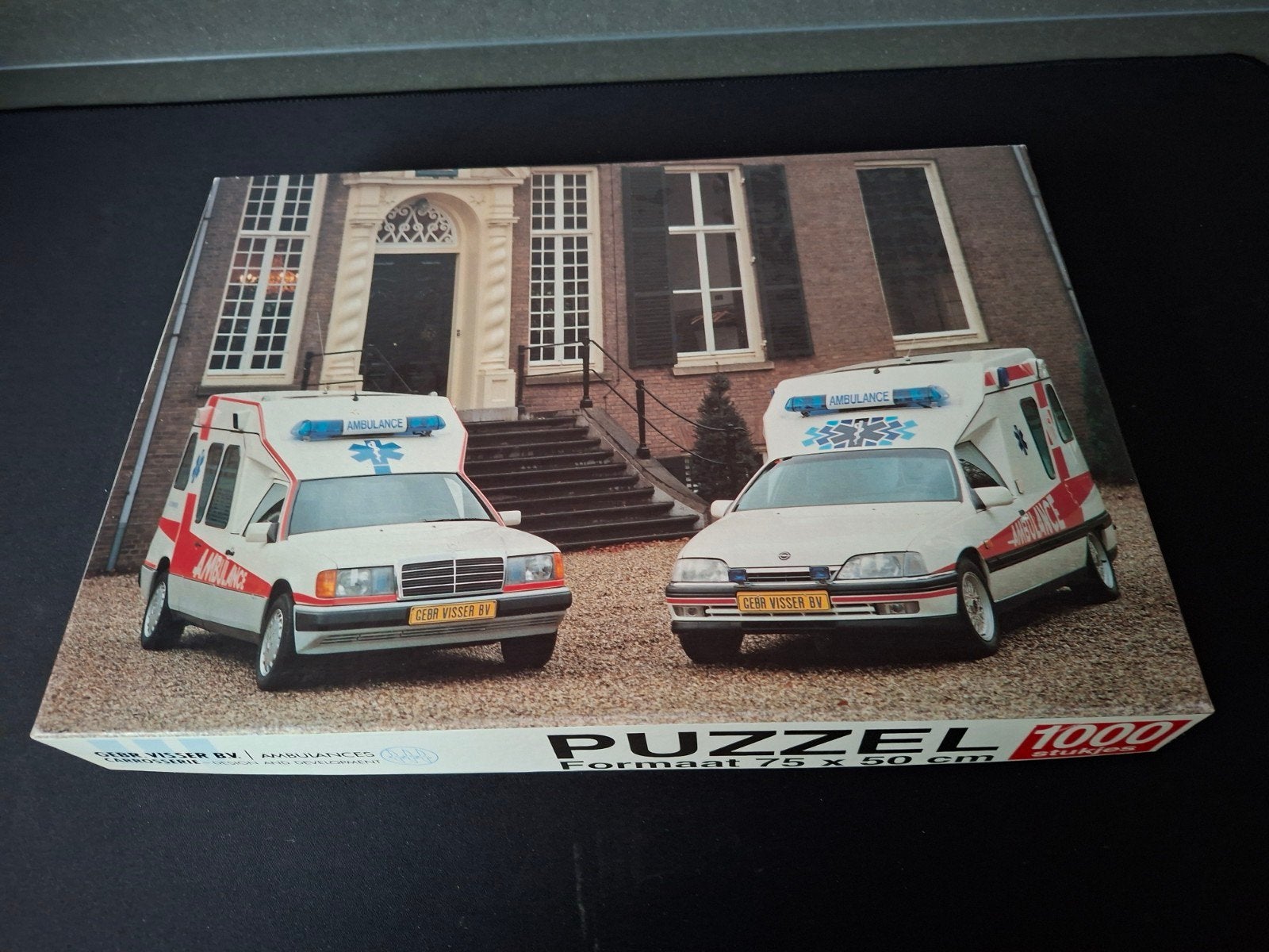 Puzzel 1000 stukjes - Ambulance Gebr. Visser BV, Een of twee spelers, Ophalen of Verzenden, Zo goed als nieuw, Gebr. Visser BV