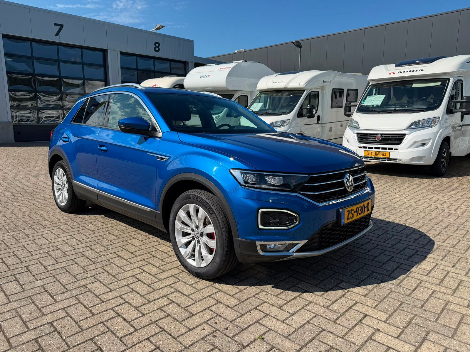 Volkswagen T-Roc 1.5 TSI 150pk 7-DSG 2019 SPORT, Auto's, 1498 cc, 4 cilinders, Blauw, Bedrijf