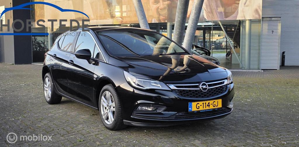 Opel Astra 1.0 Turbo 120 Jaar Edition, Auto's, Gebruikt, Euro 6, 610 kg, Zwart