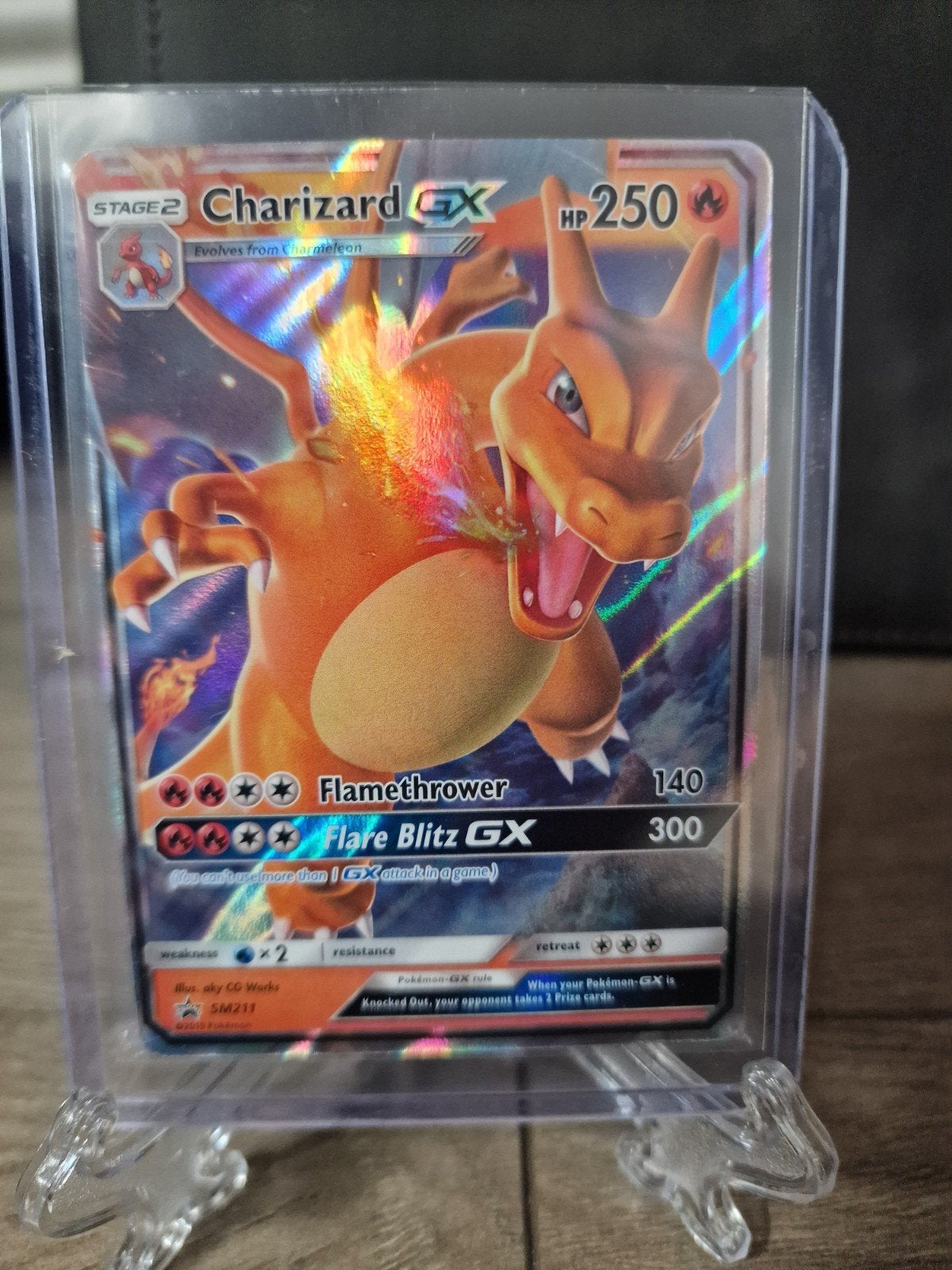Charizard GX SM211, Ophalen of Verzenden, Zo goed als nieuw, Losse kaart, Foil