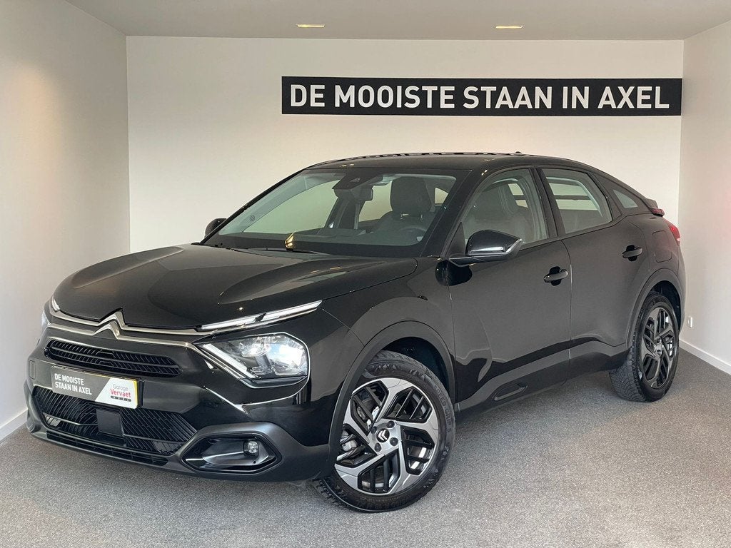 Citroën C4 1.2 Puretech Shine (bj 2023, automaat), Auto's, Citroën, Gebruikt, 1199 cc, Leder en Stof, Zwart