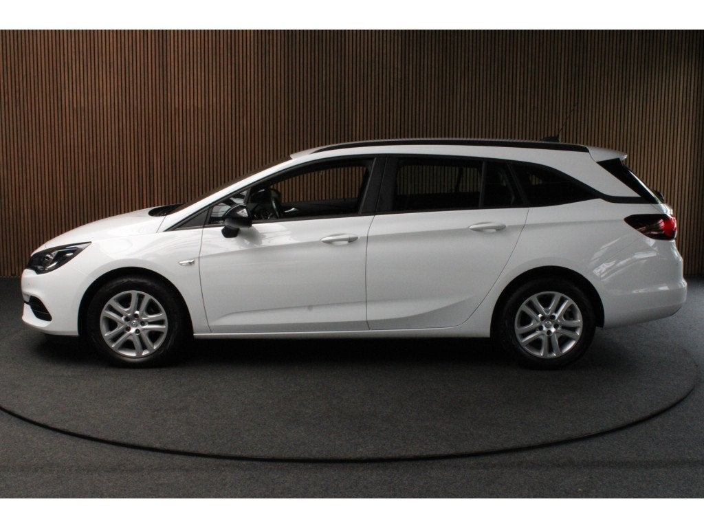 Opel Astra Sports Tourer 1.2T Navi Stoel- & stuurverw. Airco, Voorwielaandrijving, Dealer onderhouden, Zwart, 1199 cc