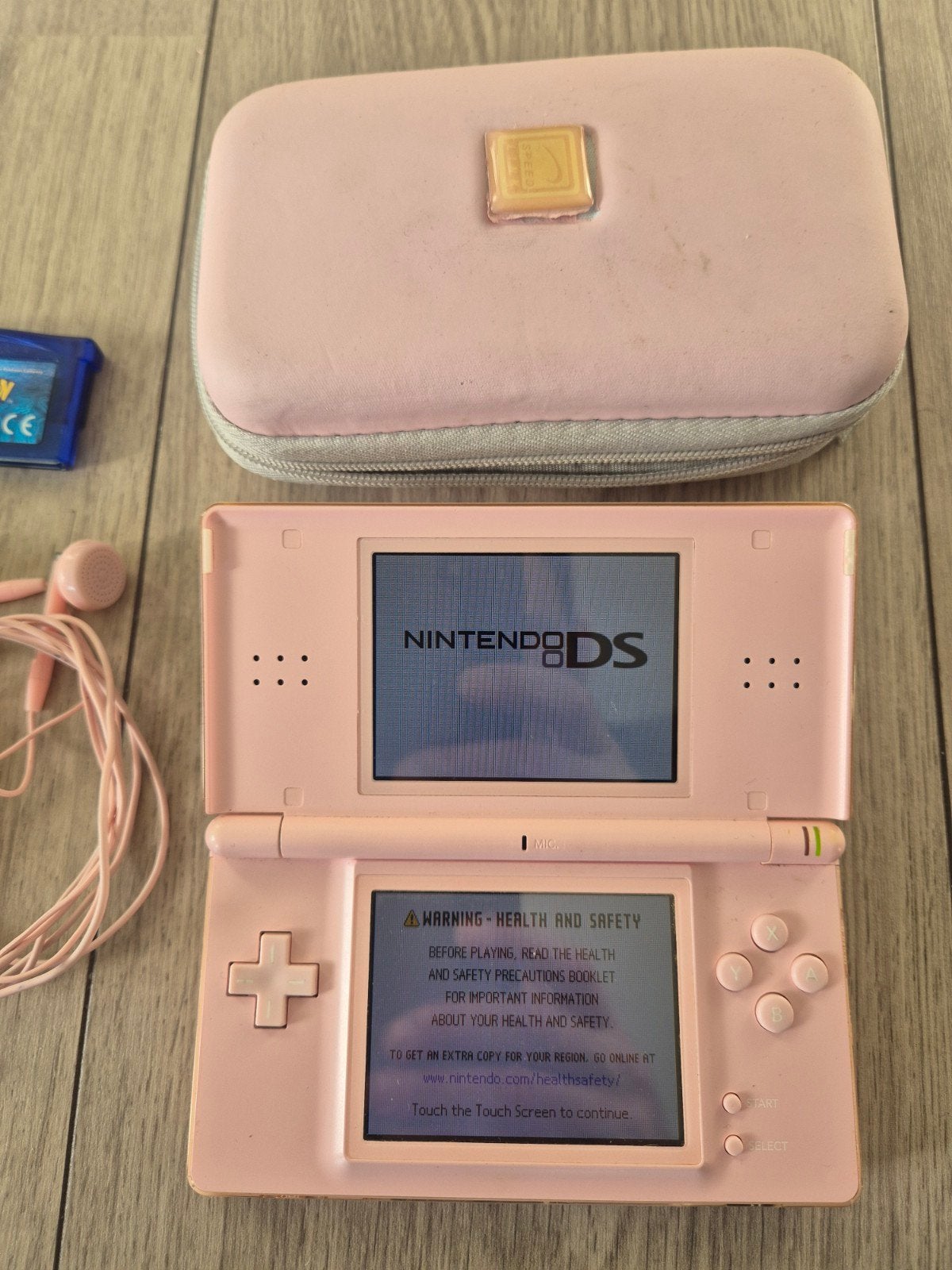 Roze Nintendo DS Lite met Pokémon Sapphire en hoes, Met games, Ophalen of Verzenden, Zo goed als nieuw, Roze