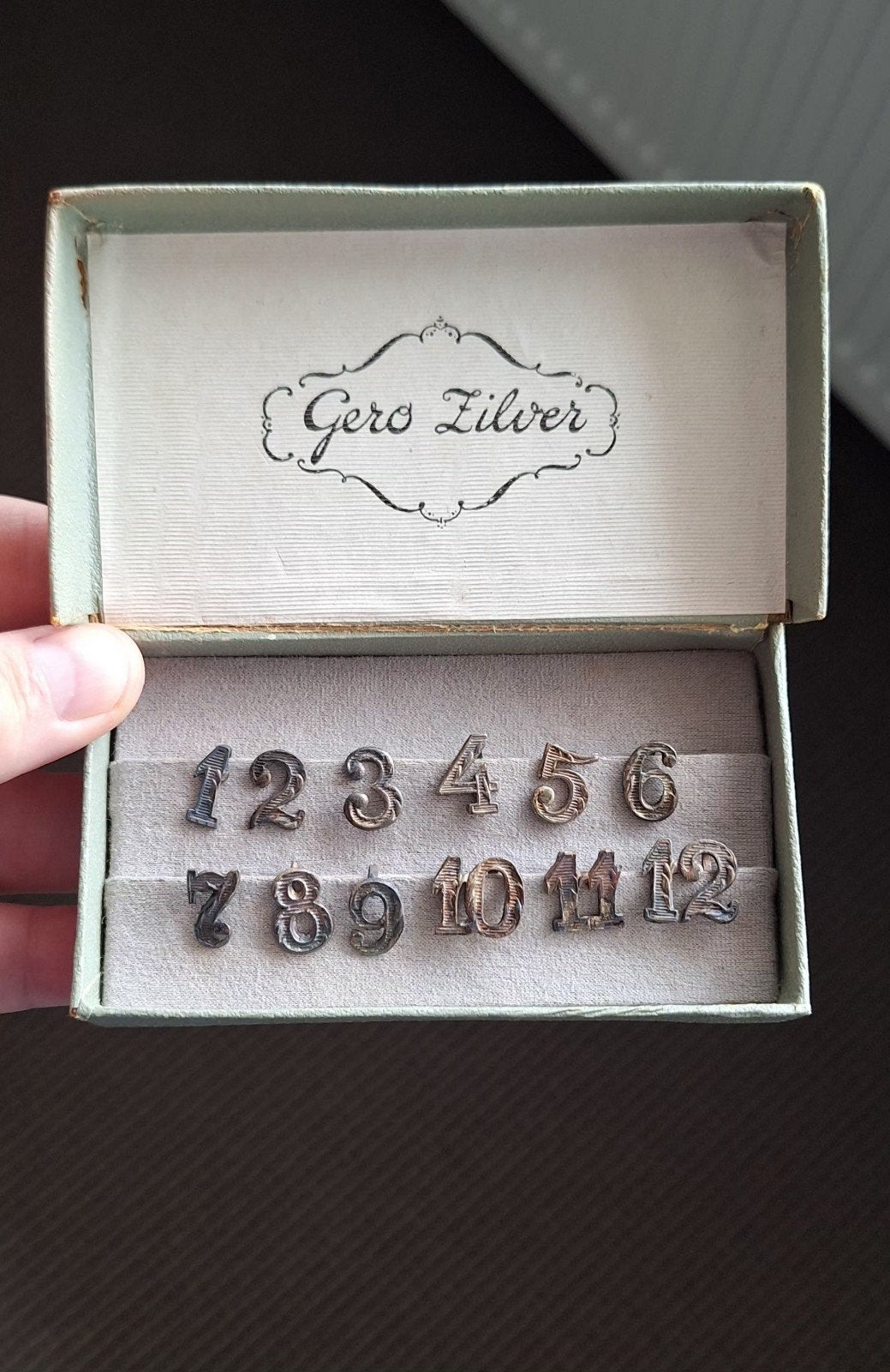 Art Deco Gero verzilverde tafelnummers in doosje (1 t/m 12)., Antiek en Kunst, Ophalen of Verzenden