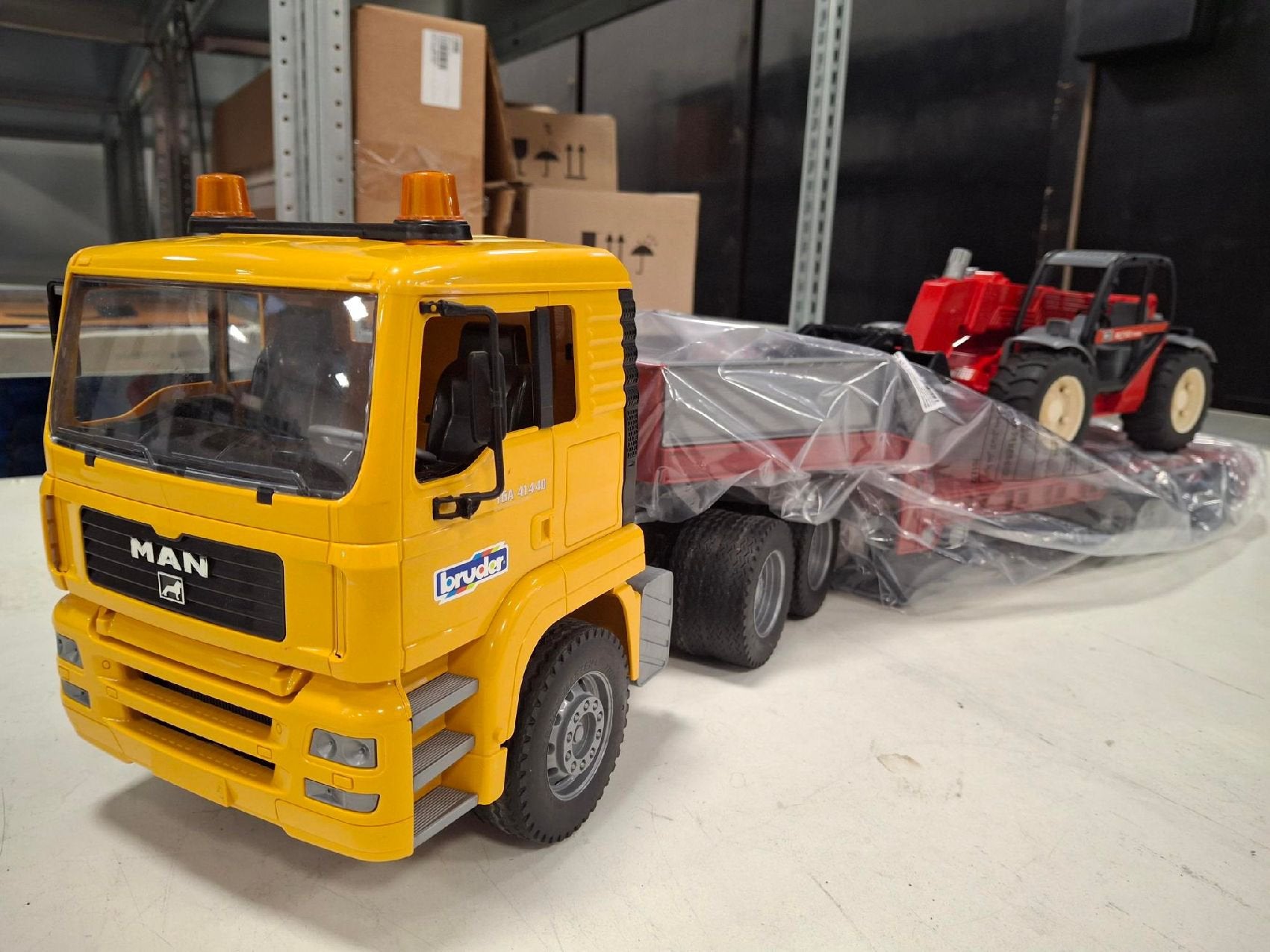 Bruder MAN TGA met dieplader en Manitou MLT 633, Ophalen of Verzenden, Zo goed als nieuw