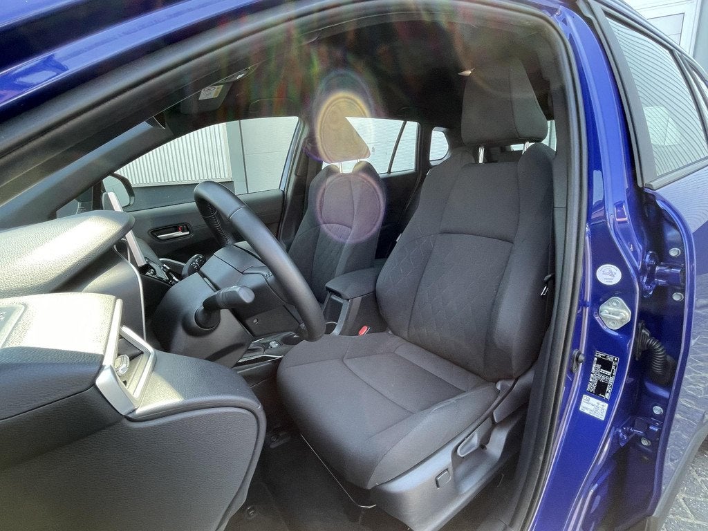 Toyota Corolla Cross Hybrid 140 Business | Parkeersensoren V, Auto's, Stof, Blauw, Bedrijf, Hybride Elektrisch/Benzine