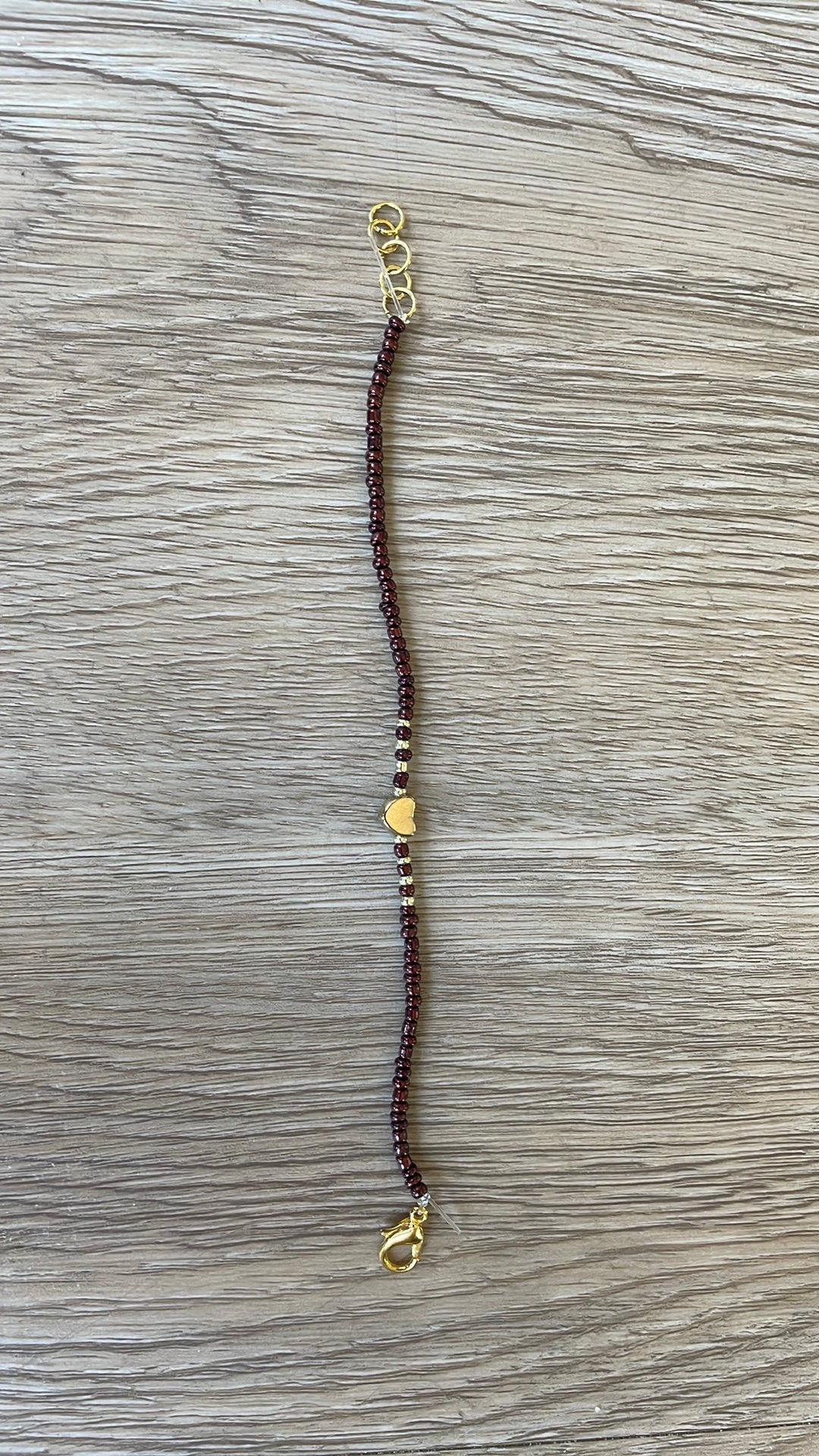 Armband bruin en goud, Bruin, Verzenden, Kunststof of Plastic, Nieuw