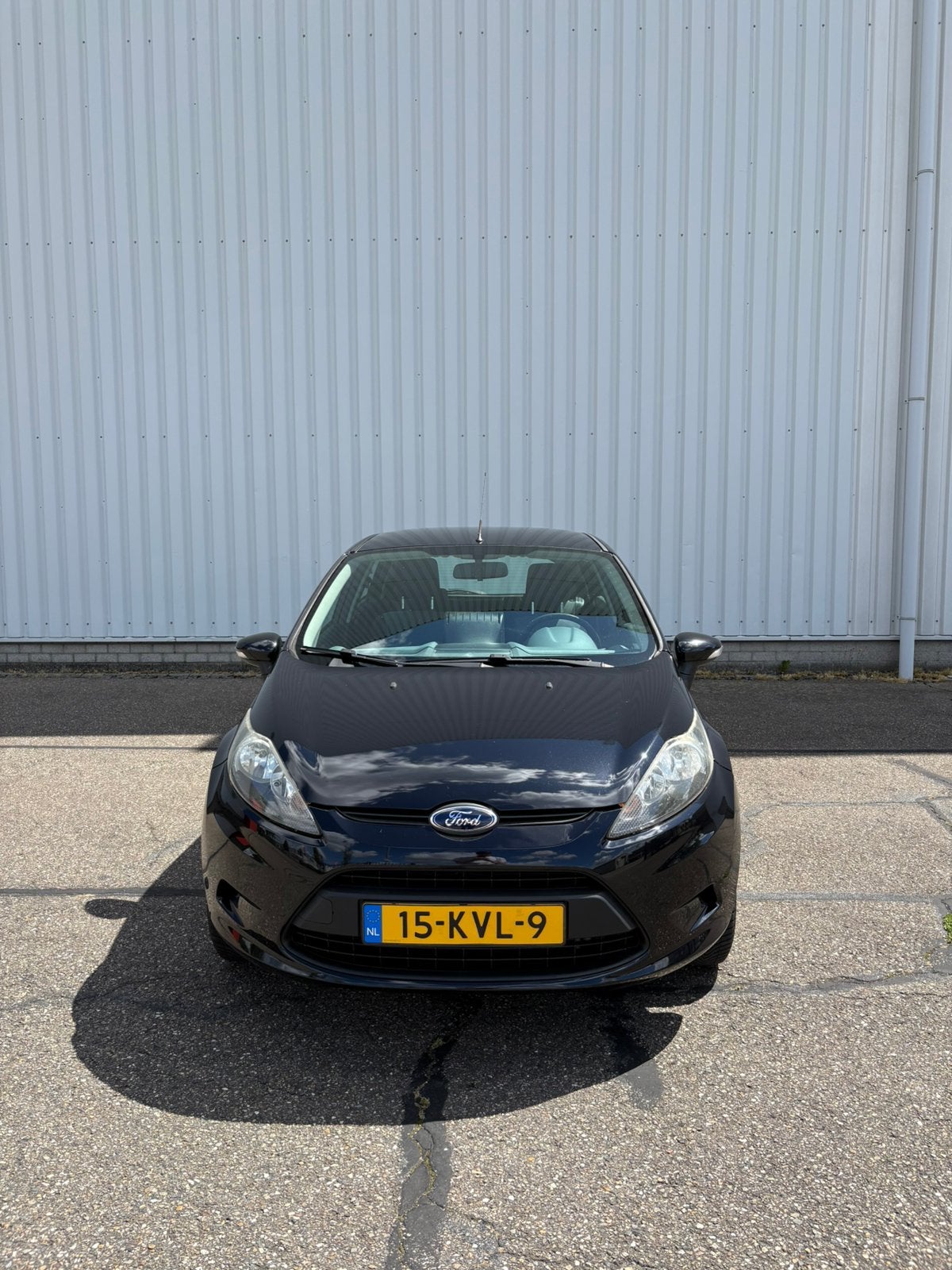 Ford Fiësta 1.25 60KW 5DR 2010 Zwart, Auto's, Ford, Voorwielaandrijving, Euro 5, Stof, 1242 cc
