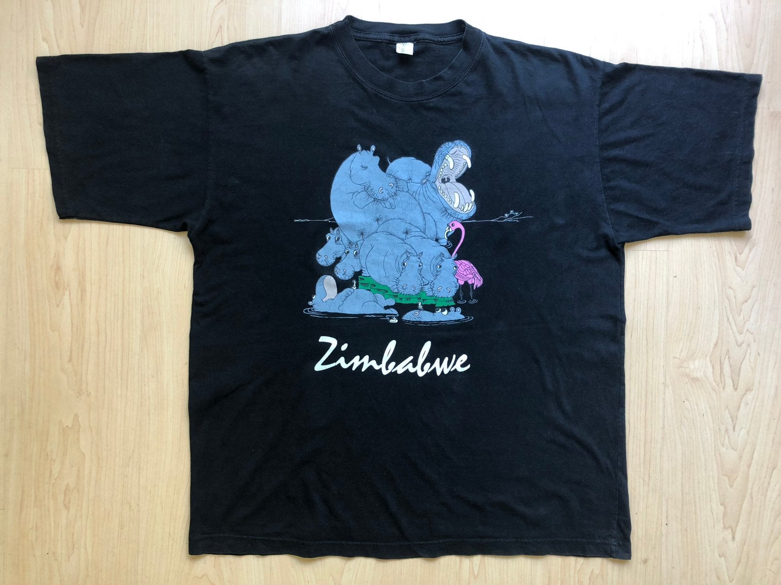 Zwart T-shirt uit Zimbabwe (maat XXL nijlpaarden hippo’s), Ophalen of Verzenden, Zo goed als nieuw, Overige maten, Zwart