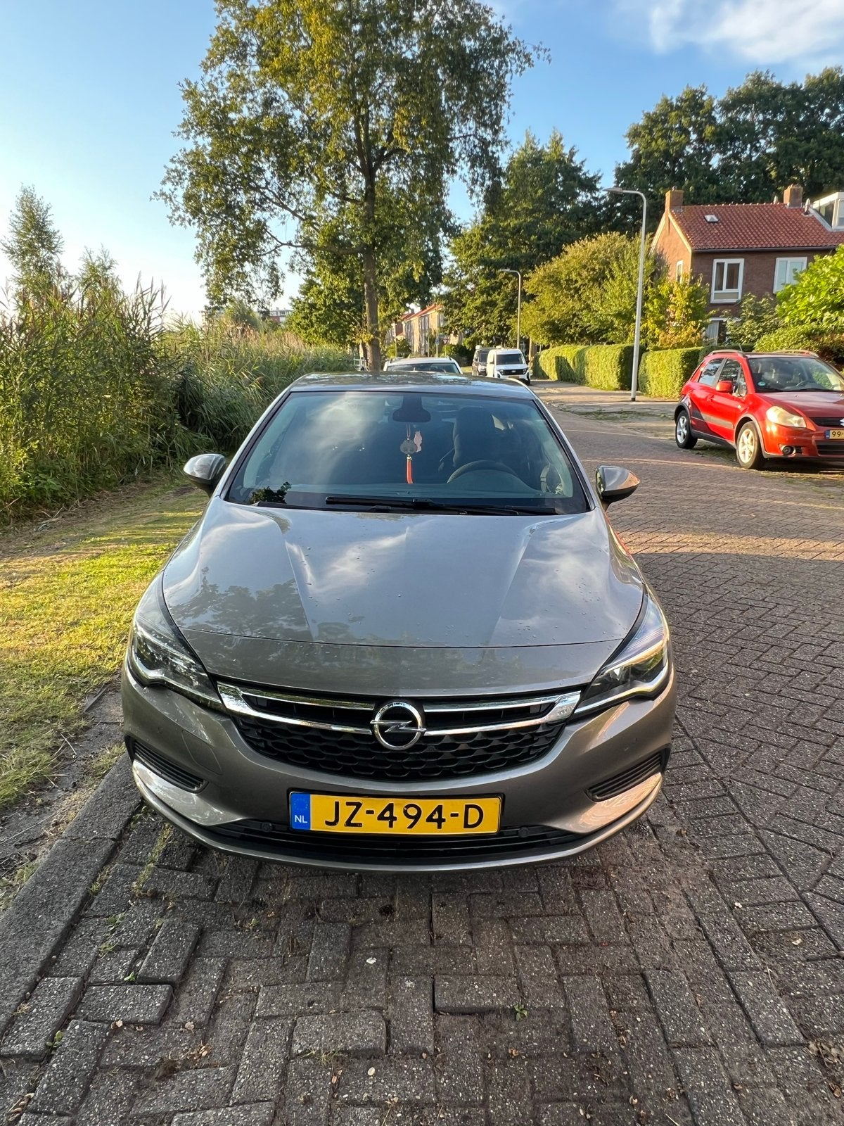 Opel Astra 1.0 Turbo 77KW 5D 2016 Bruin, Auto's, Bruin, 610 kg, 23 km/l, Origineel Nederlands