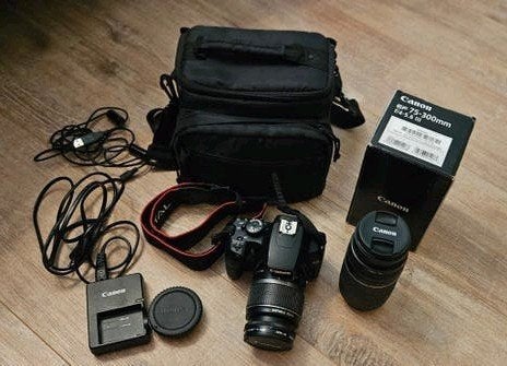 Canon EOS 1000D met EF-S 18-55mm en EF 75-300mm lenzen, Autofocus, Canon, Zo goed als nieuw, Canon EF