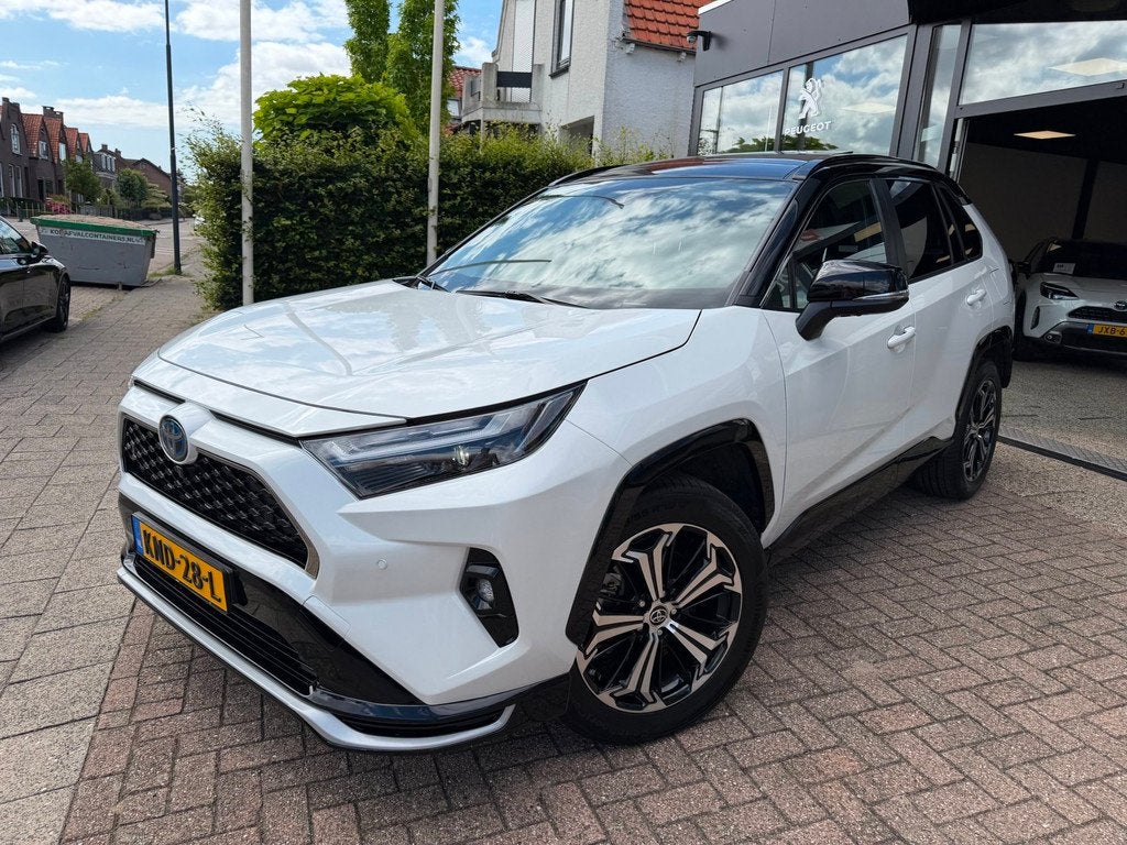 Toyota RAV4 2.5 Plug-in Hybrid AWD Bi-Tone Plus|Pano|Stoel V, Auto's, Toyota, Automaat, Gebruikt, 4 cilinders, Wit