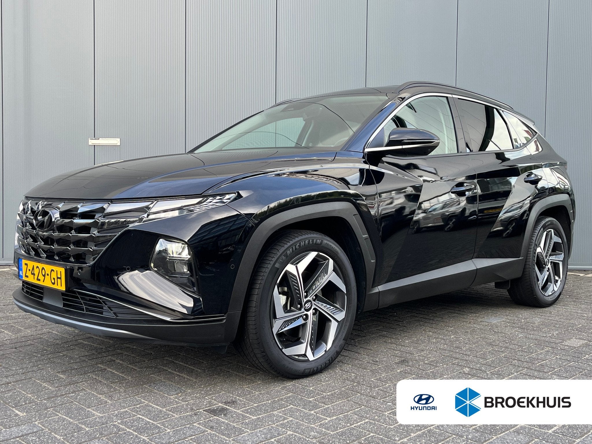 Hyundai Tucson 1.6 T-GDI 265pk PHEV Premium 4WD, Auto's, Gebruikt, 4 cilinders, Zwart, Bedrijf