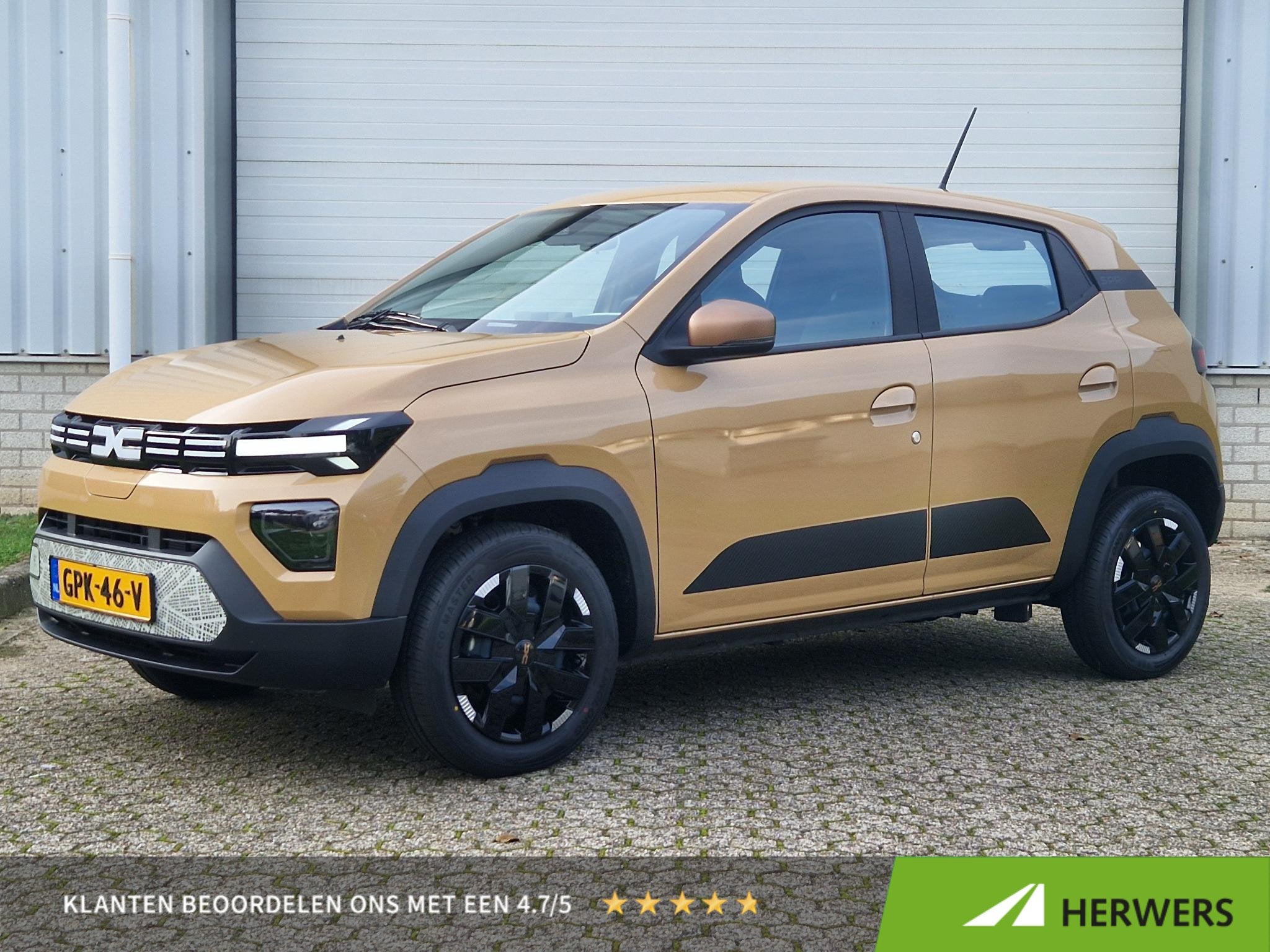 Dacia Spring Extreme 65PK 27 kWh / Airco / DAB Radio / Navig, Auto's, Dealer onderhouden, 4 stoelen, Leder en Stof, Beige