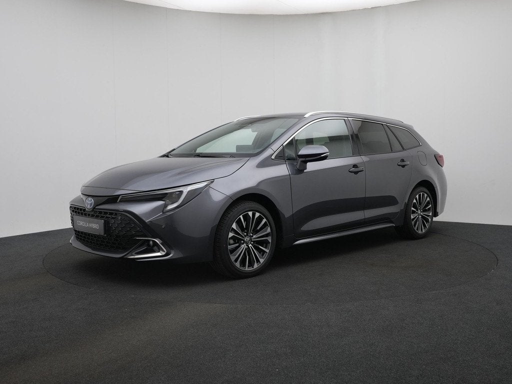 Toyota Corolla Touring Sports Hybrid 200 PK Dynamic || Nieuw, Auto's, Toyota, 12 maanden, Stof, Zwart, 4 cilinders