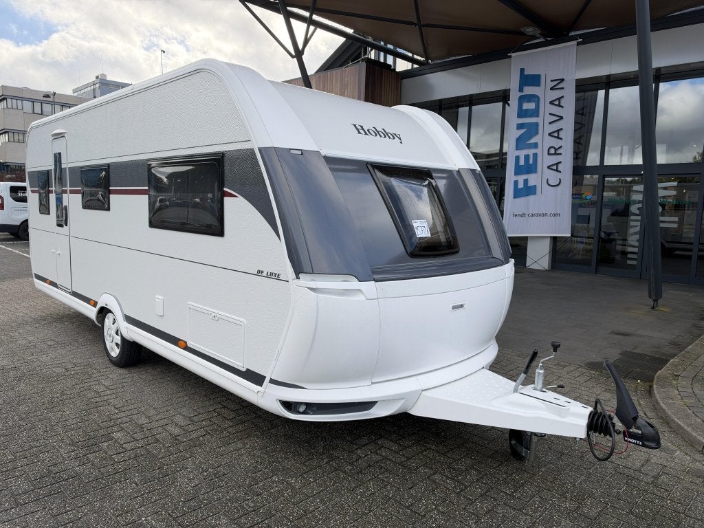 Hobby De Luxe 540 KMFE 2027 STAPELBED / SPECIALE BEKLEDING, Caravans en Kamperen, Serviceluik, Bedrijf, Treinzit, 5 tot 6 meter