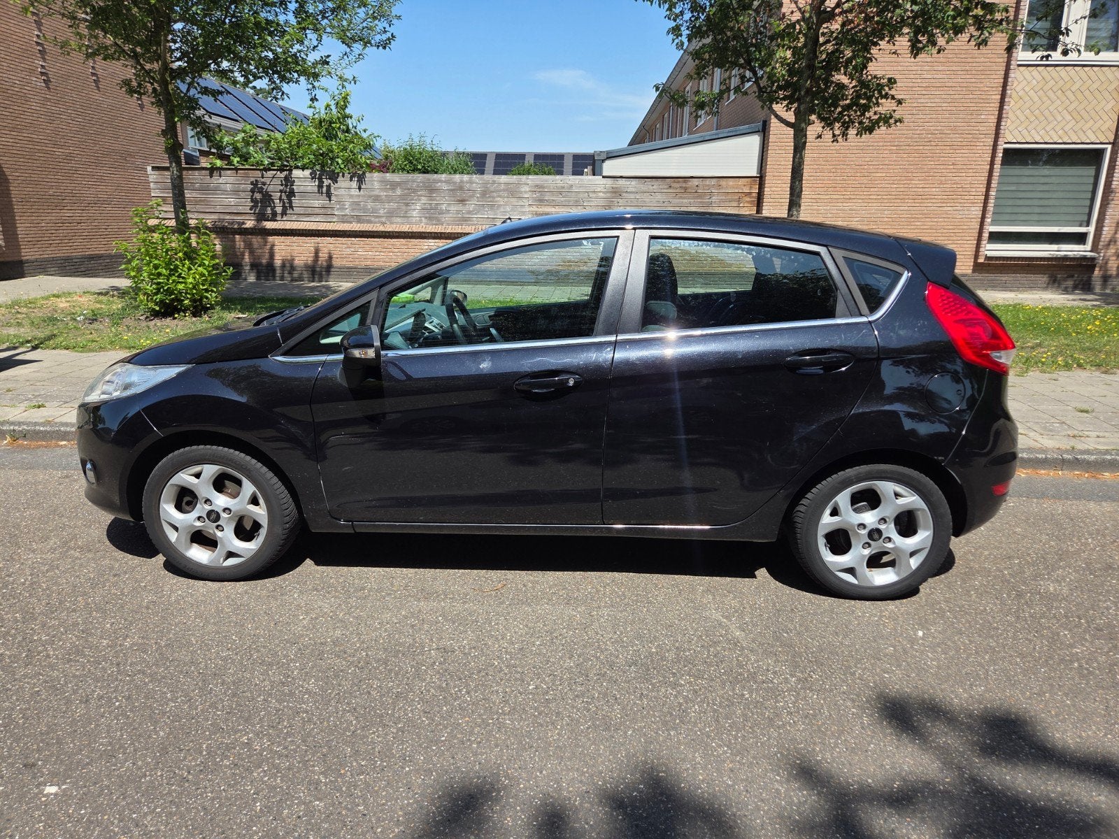 Ford Fiësta 1.25 60KW 5DR 2011 Zwart, Auto's, Voorwielaandrijving, Stof, Zwart, Origineel Nederlands