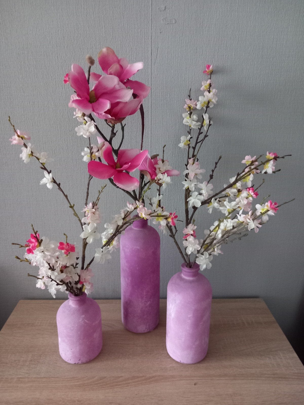 3 vazen met zijdebloemen, Ophalen