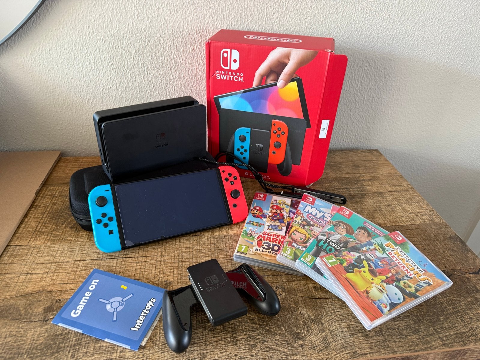 Nintendo Switch OLED met 4 spellen en accessoires