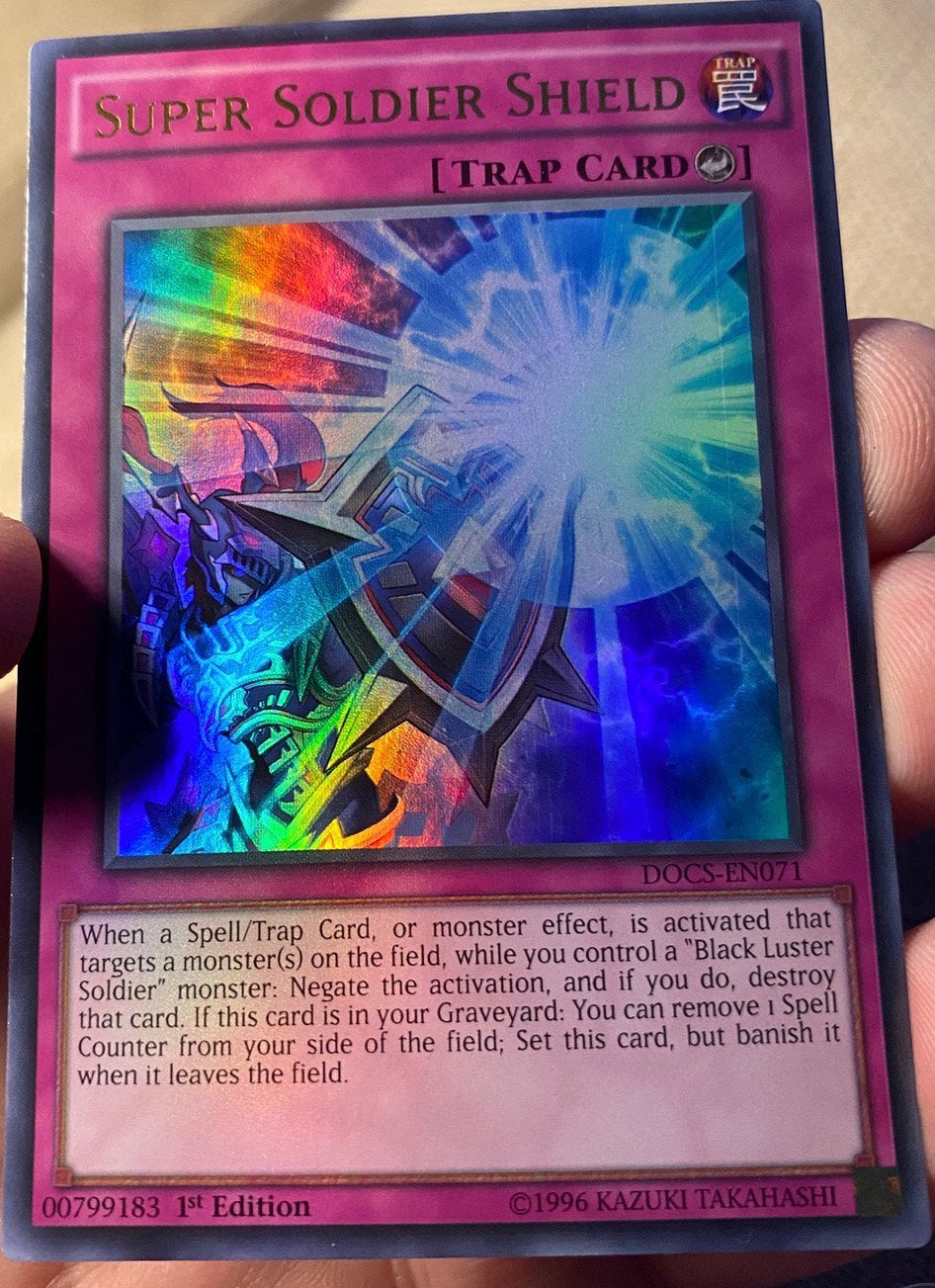 Yu-Gi-Oh! Super Soldier Shield DOCS 1st Edition !, Ophalen of Verzenden, Zo goed als nieuw, Losse kaart, Foil