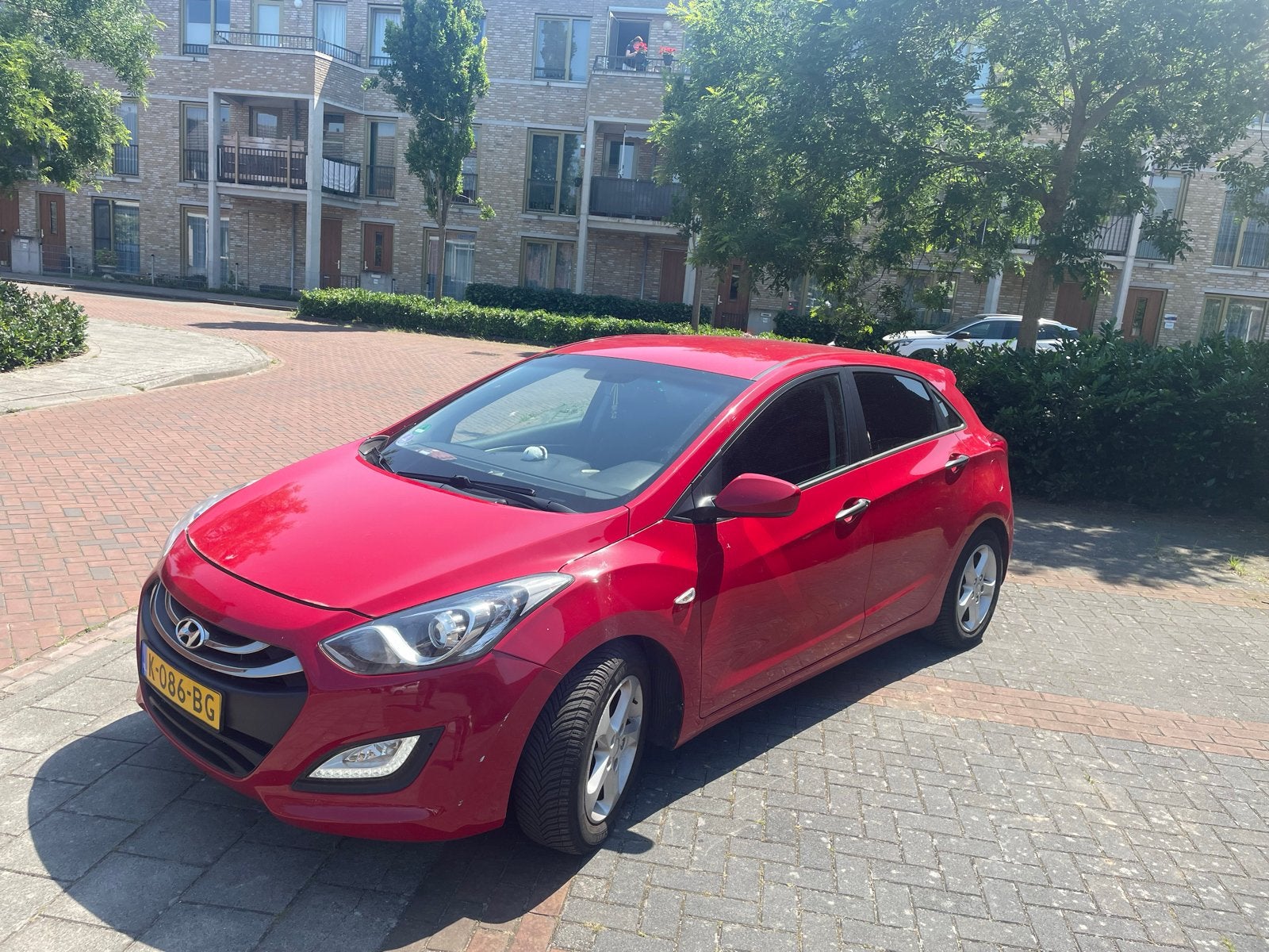 Hyundai i30 1.4 I Cvvt 5DR  2013 Rood/nettestaat/, Voorwielaandrijving, 1160 kg, Stof, Zwart