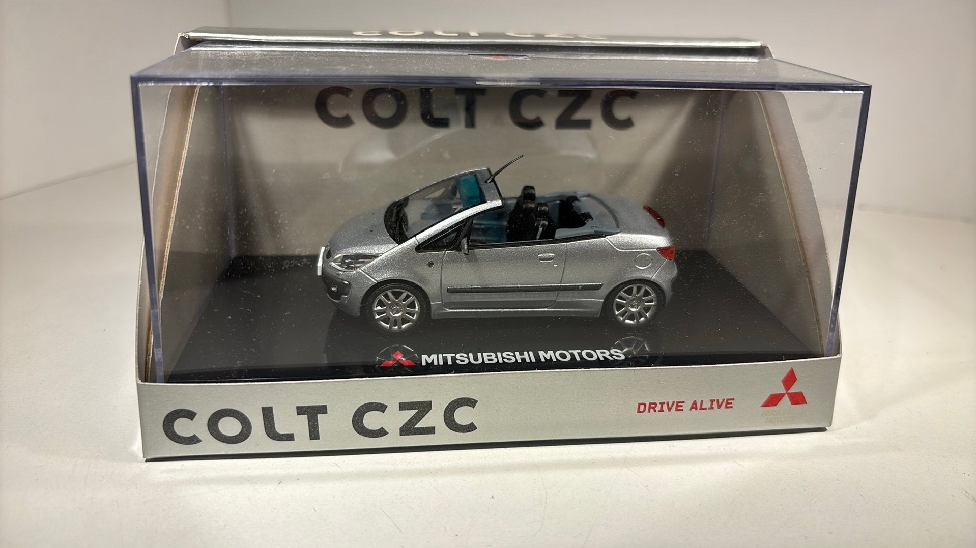 Mitsubishi colt czc silver sun star 1.43, Hobby en Vrije tijd, Modelauto's | 1:43, Overige merken, Auto, Ophalen of Verzenden
