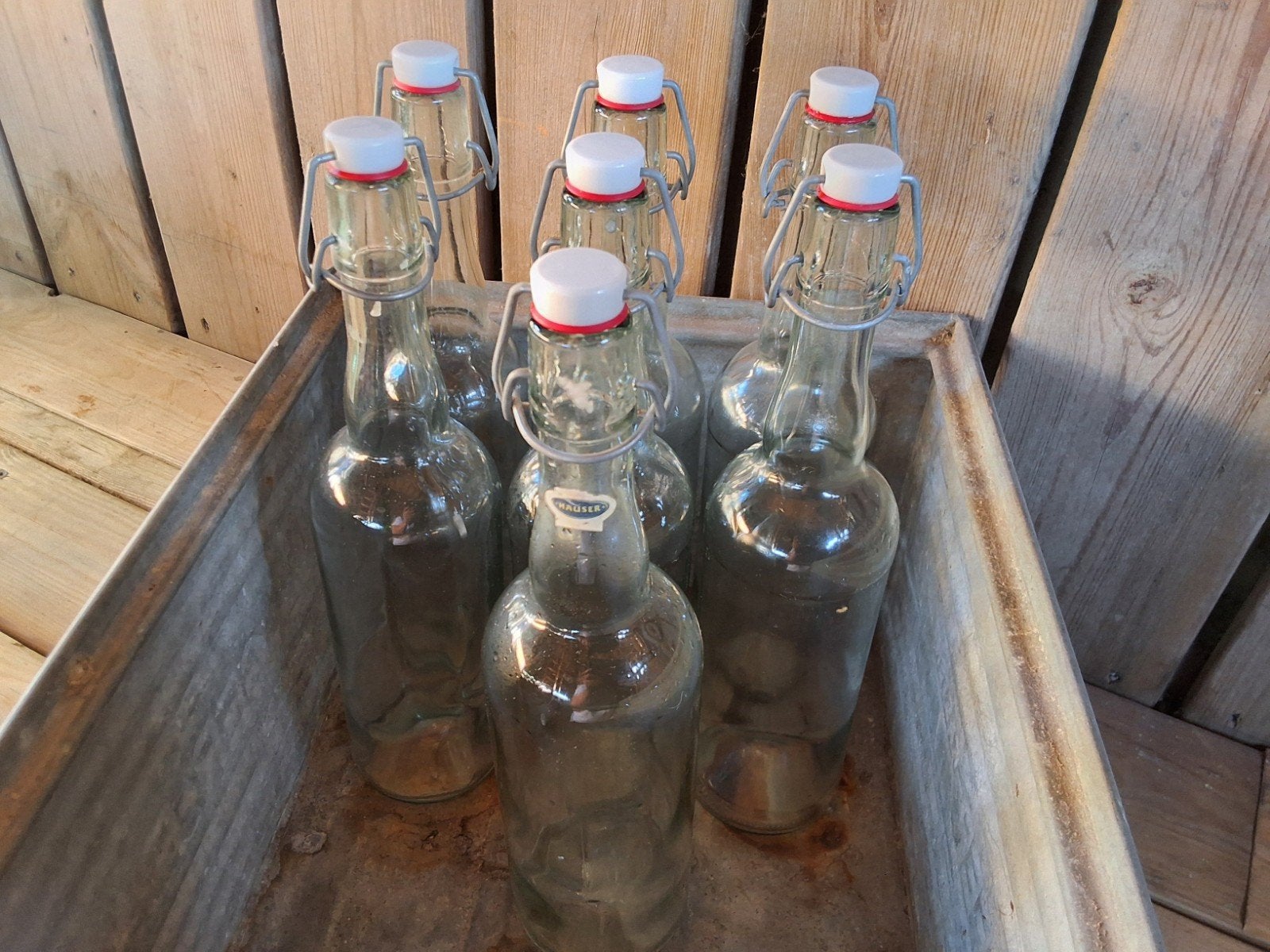 7 glazen Hauser flessen, Voorraadpot, Ophalen of Verzenden, Zo goed als nieuw, Glas