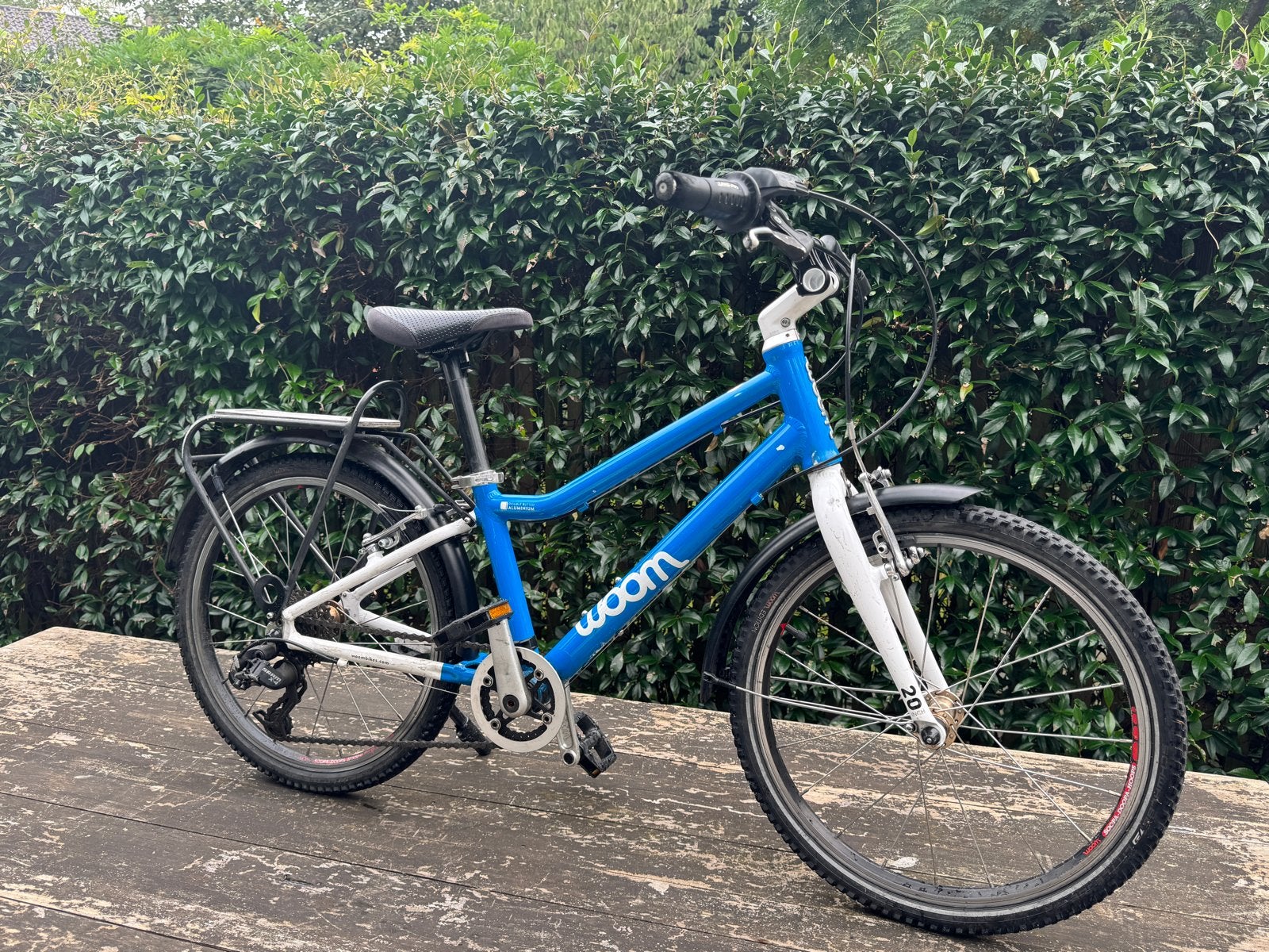 Woom 4 kinderfiets - Blauw, 20 inch, Ophalen, Gebruikt, Velgrem, 20 inch of meer
