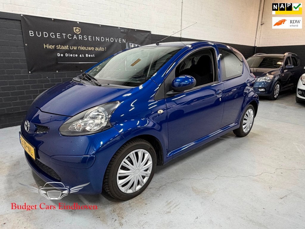Toyota Aygo 1.0-12V + Nap/5Drs/APK 01-2027!, Auto's, Toyota, Voorwielaandrijving, Stof, Gebruikt, Zwart