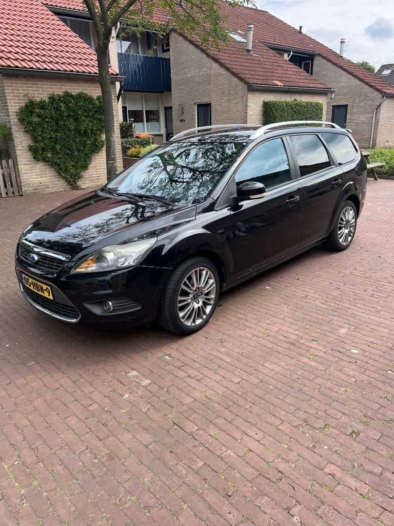 Ford Focus 1.8 Titanium Flexifuel (2008) – APK t/m mei 2027, Auto's, Ford, 125 pk, Zwart, 4 cilinders, Leder en Stof