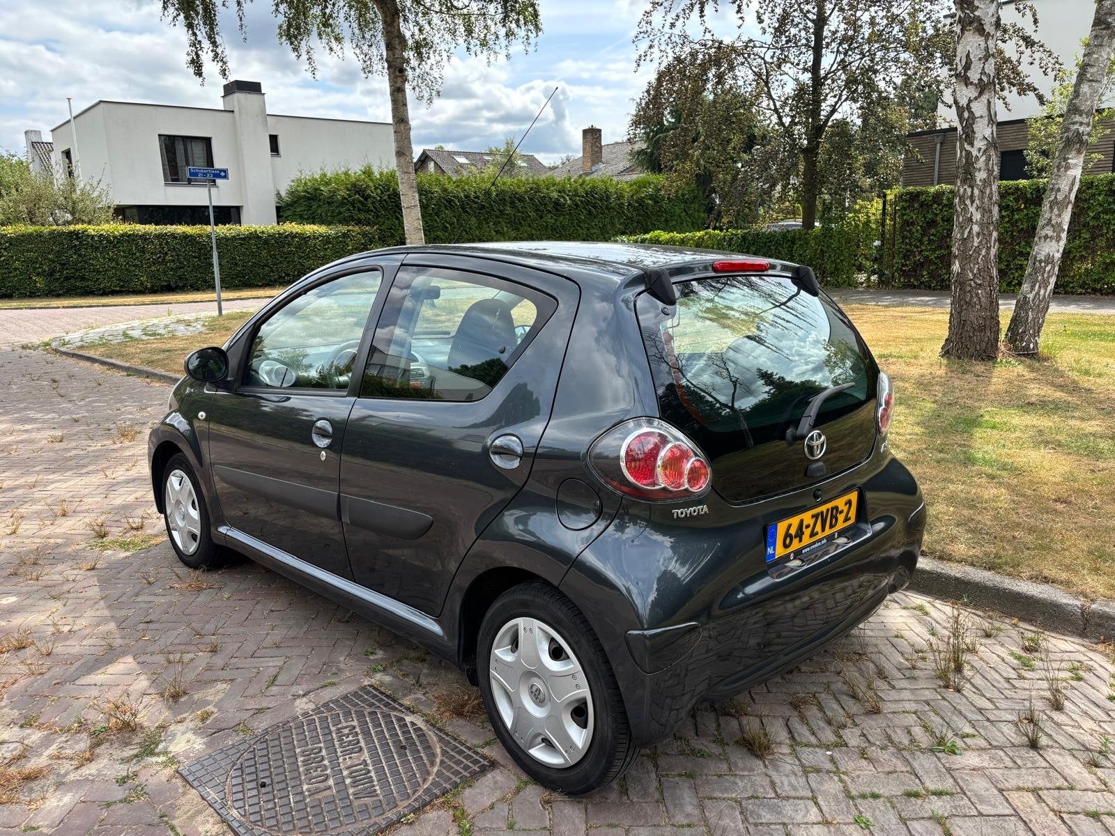 Toyota Aygo 1.0 12V Vvt-i 5DRS 2012 Grijs, Auto's, Voorwielaandrijving, 4 stoelen, Handgeschakeld, Particulier