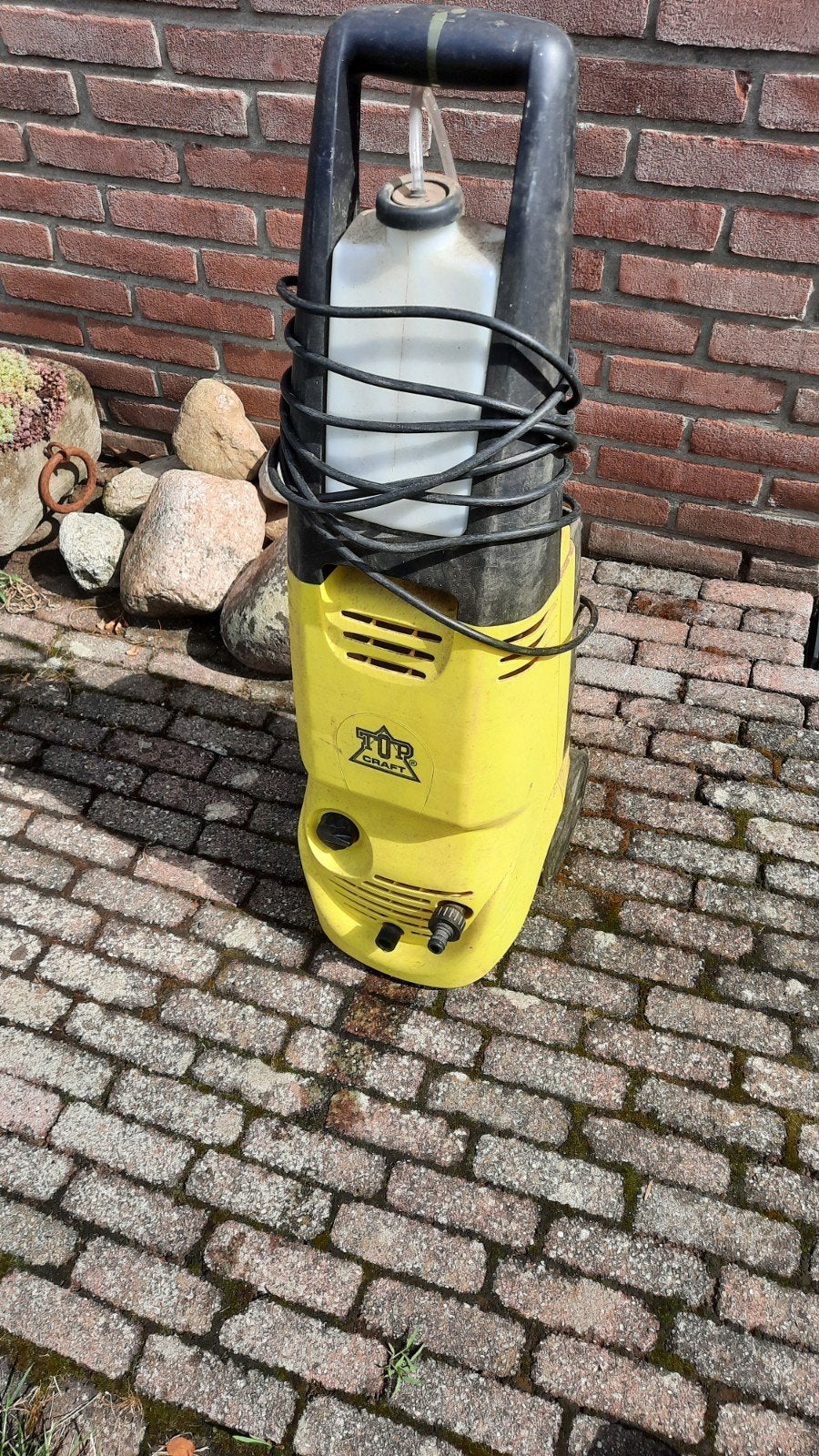 Hoge drukspuit'terras reiniger, Ophalen