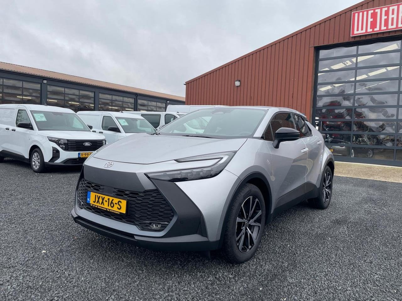Toyota C-HR PHEV 2.0 PLUG-IN HYBRID 220 DYNAMIC (bj 2025), Auto's, Stof, Zwart, 4 cilinders, Met garantie (alle)