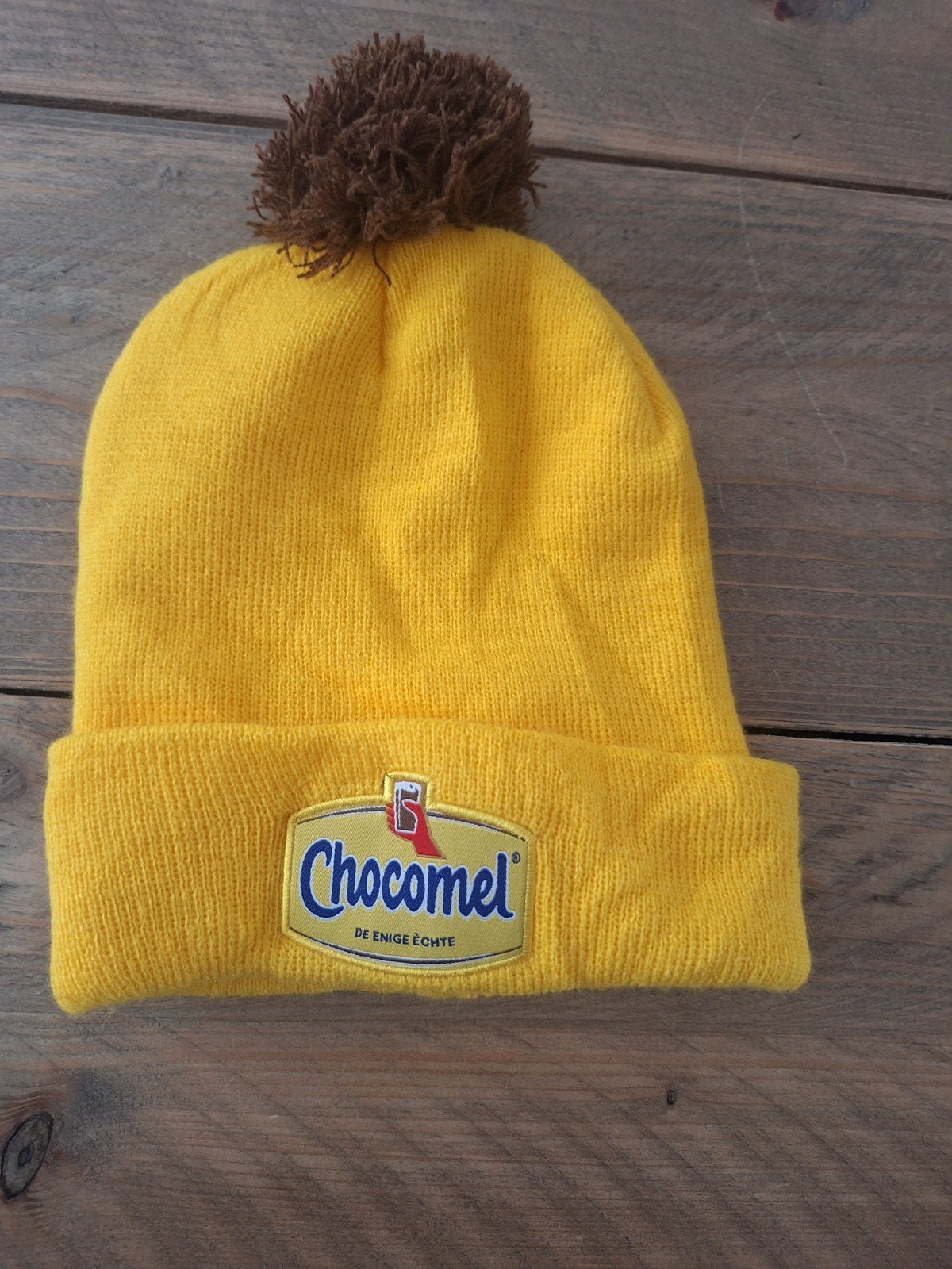 Gele Chocomel Muts met Pompon, Maat 38/40 (M), Chocomel, Ophalen of Verzenden, Zo goed als nieuw