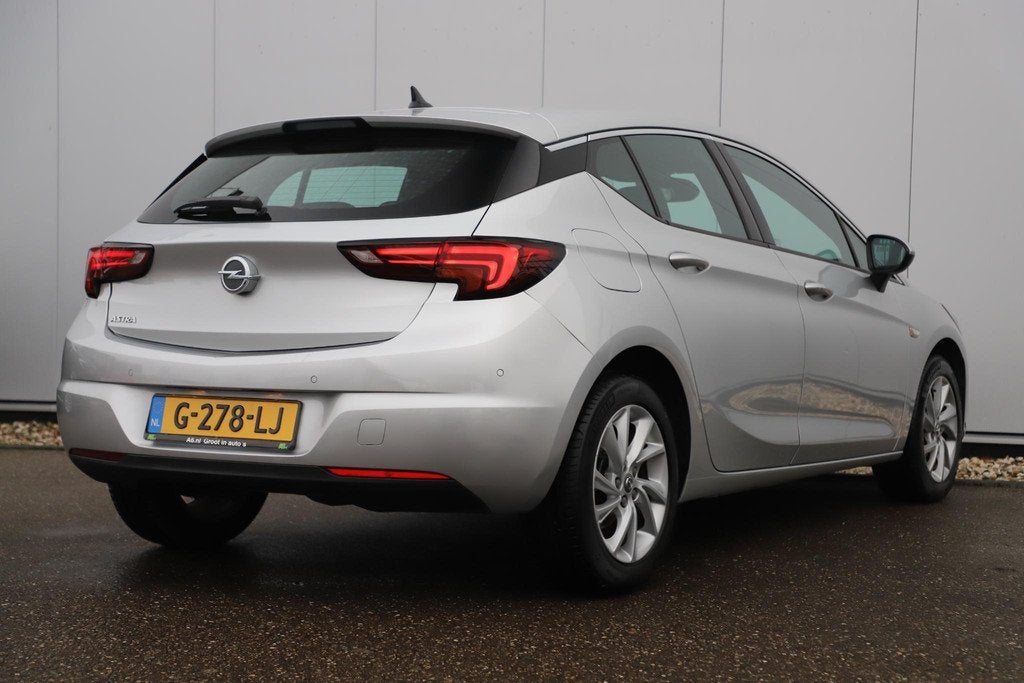 Opel Astra 1.0 Turbo Innovation Navigatie Airco Cruise Contr, Stof, Gebruikt, Met garantie (alle), 610 kg
