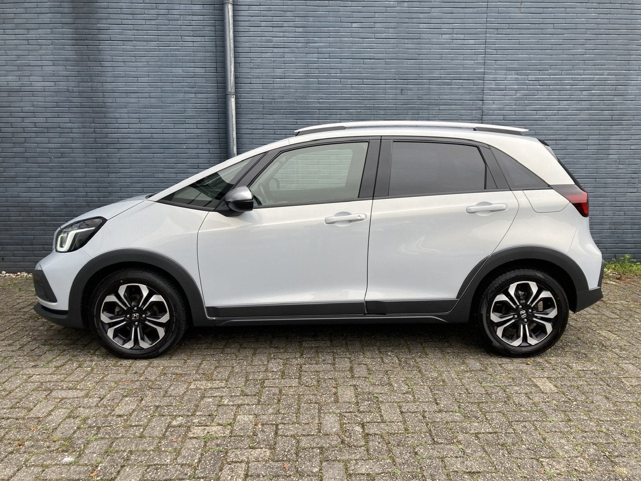 Honda Jazz 1.5 i-MMD 109pk Hybrid Automaat Crosstar | Naviga, Stof, 4 cilinders, Wit, Bedrijf