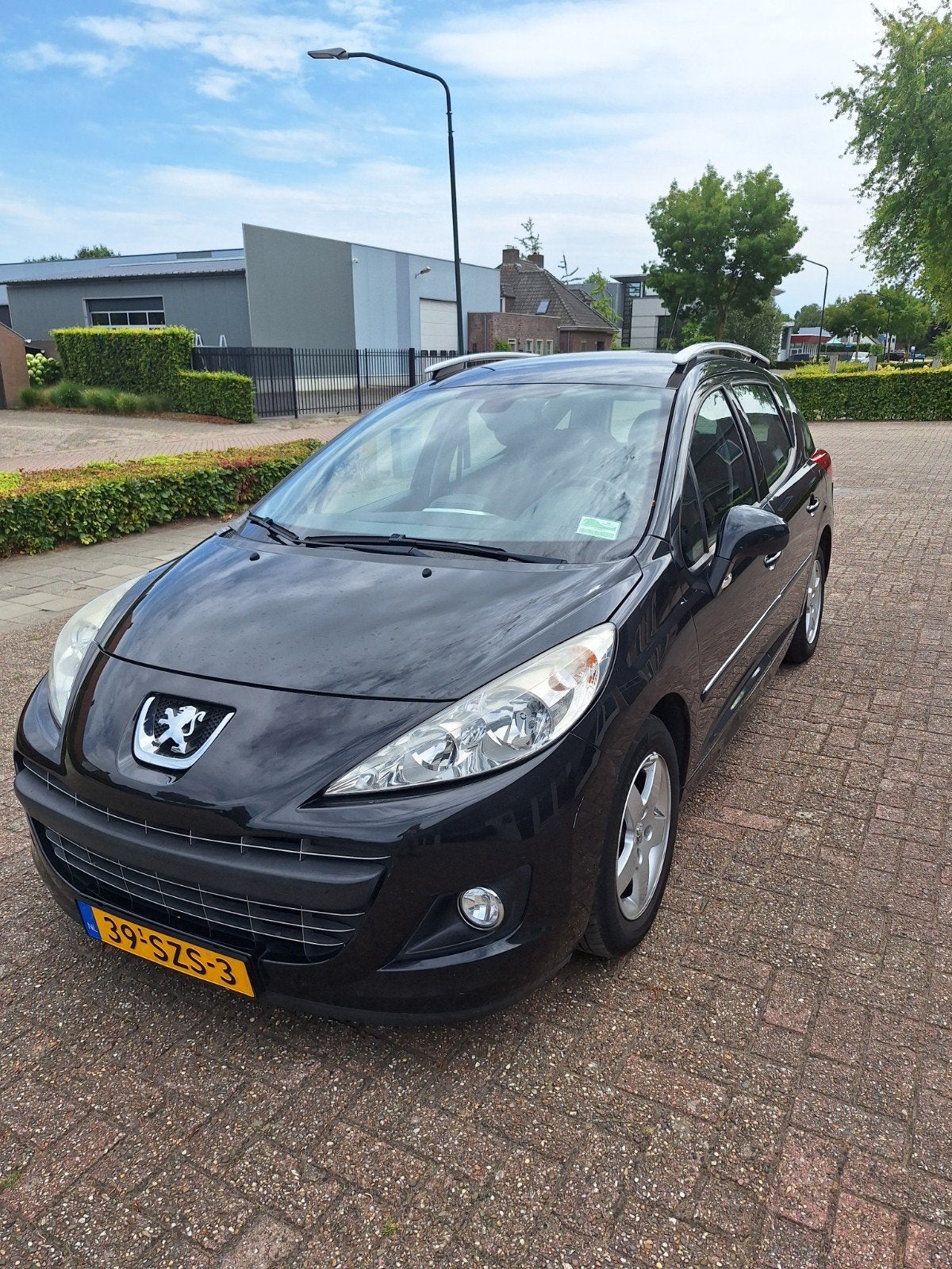 Peugeot 207 1.4 VTI 16V SW 2012 Zwart, Auto's, Voorwielaandrijving, Zwart, Zwart, Origineel Nederlands