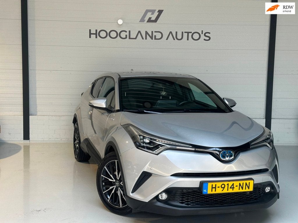 Toyota C-HR 1.8 Hybrid Bi-Tone 2017, Auto's, Euro 6, 4 cilinders, Leder en Stof, 98 pk
