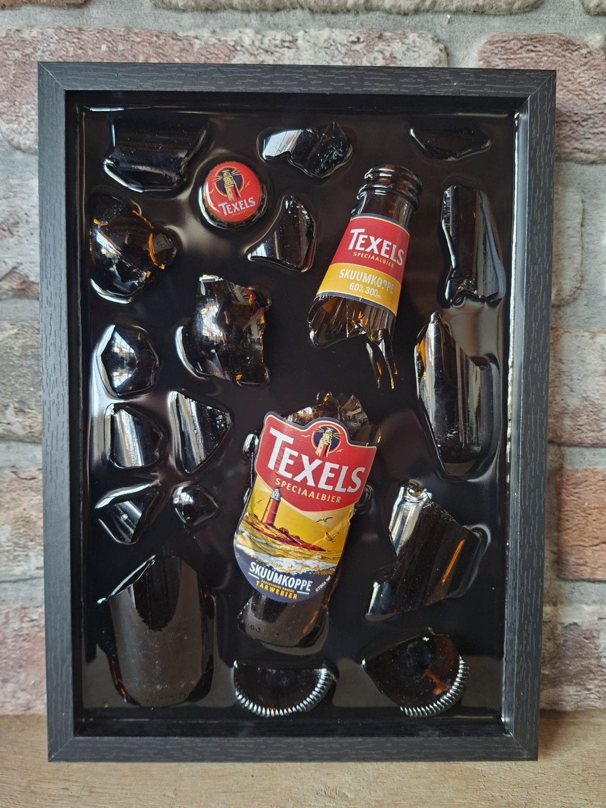 Texels skuumkoppe flesje in een lijst 23x33 met Epoxy, Ophalen of Verzenden