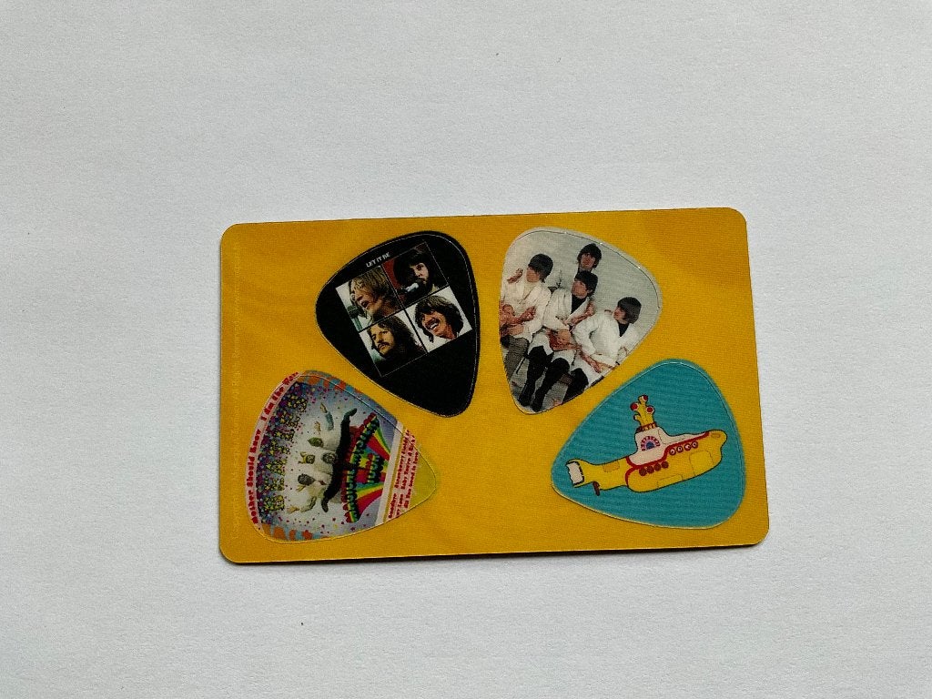 4 uitneembare plectrums van The Beatles, Nieuw, Ophalen of Verzenden, Foto of Kaart, 4 uitneembare plectrums van The Beatles